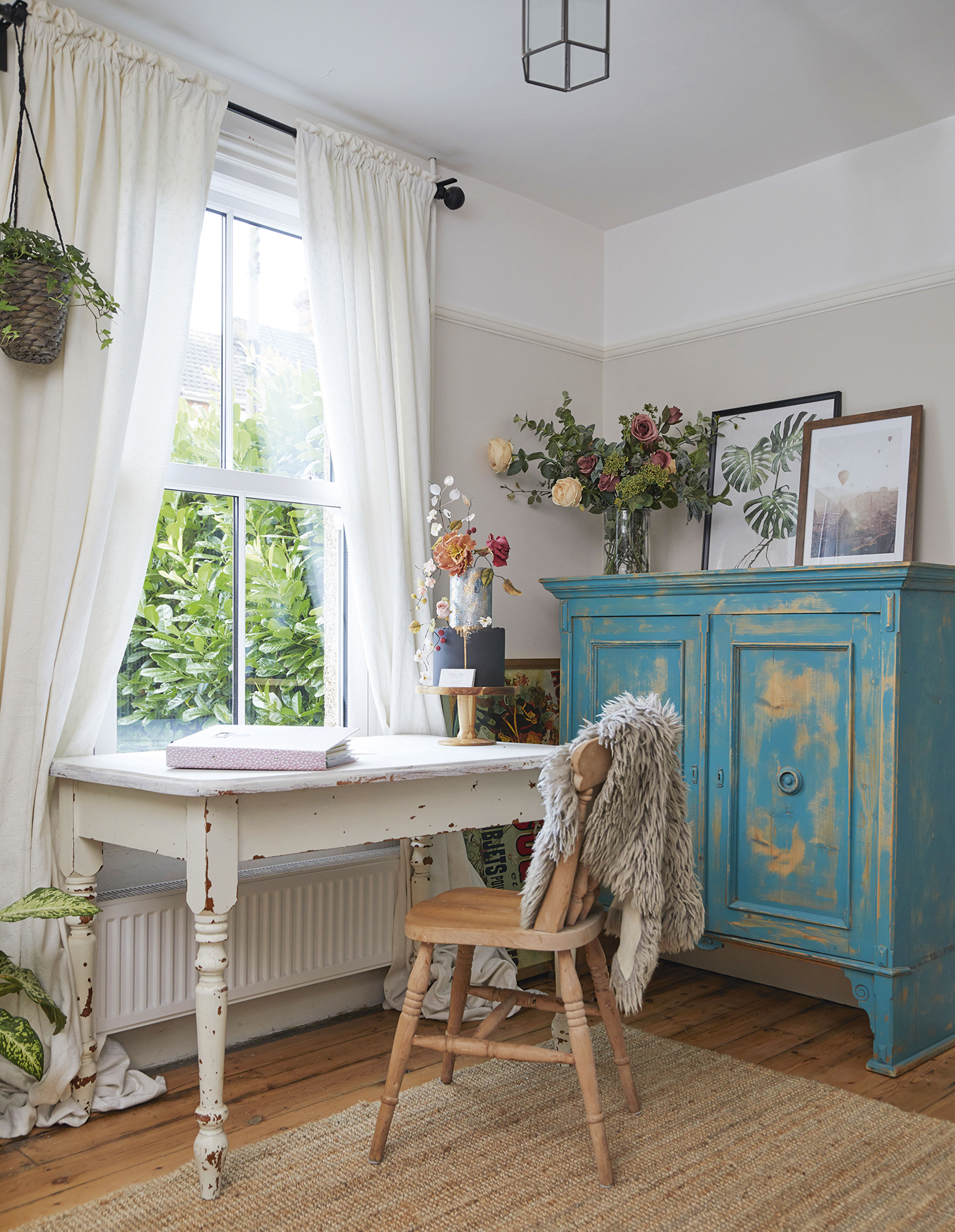 ‘I like to keep a display of my cakes on view ready for customers to see, and being by the window means this is a lovely, bright spot to work in. The room has the most shabby chic vibe in the house, but I think all my different styles complement each other’