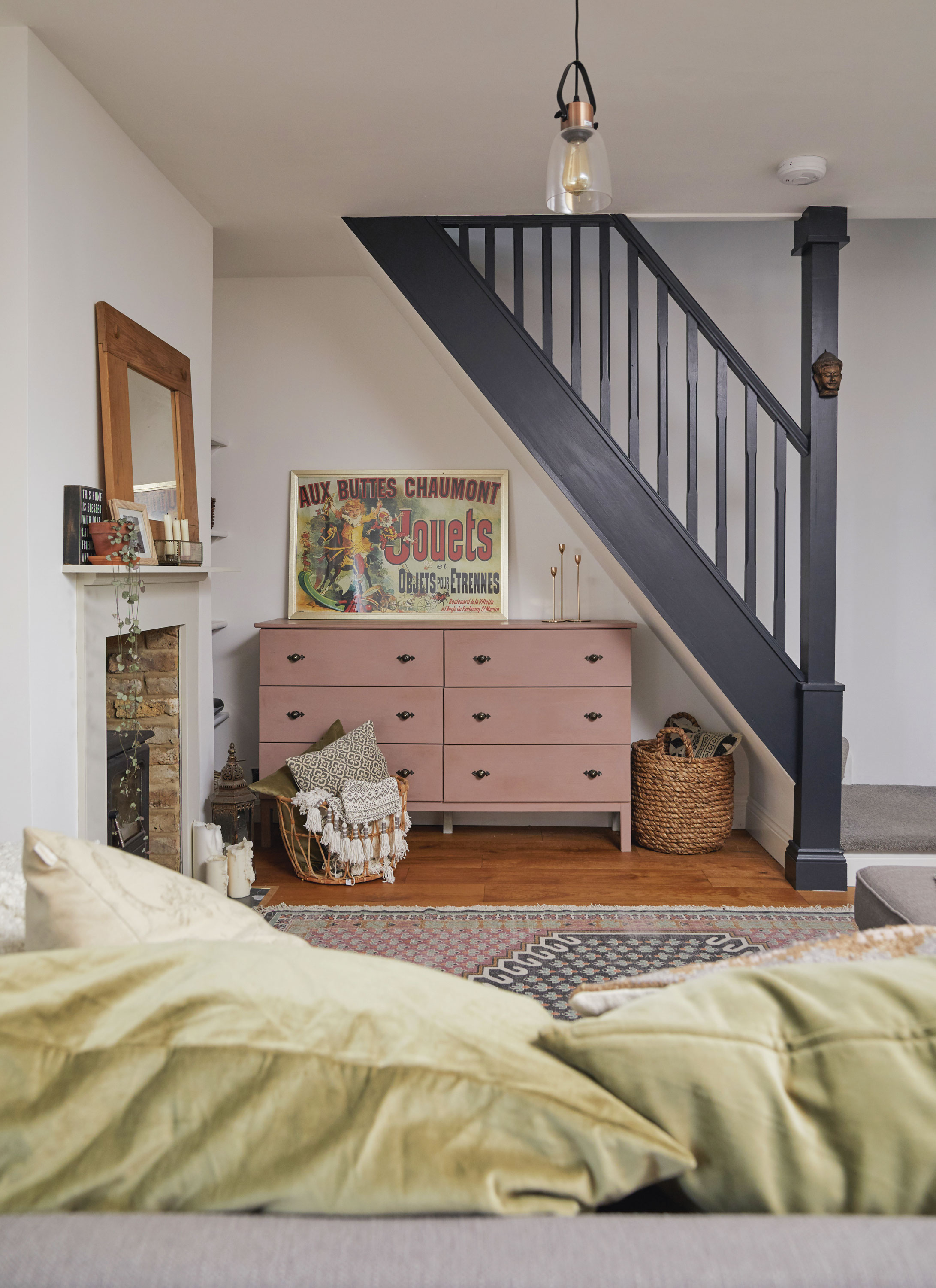 ‘The stairs were originally painted white and had a more Scandi feel but I recently changed them to Railings by Farrow & Ball and they suit my look better now, though my style is always changing. The drawers are from IKEA but painting them pink and adding the decorative handles has turned them into such a lovely looking piece. The print is a copy of the one in Monica’s apartment in Friends, my favourite show’