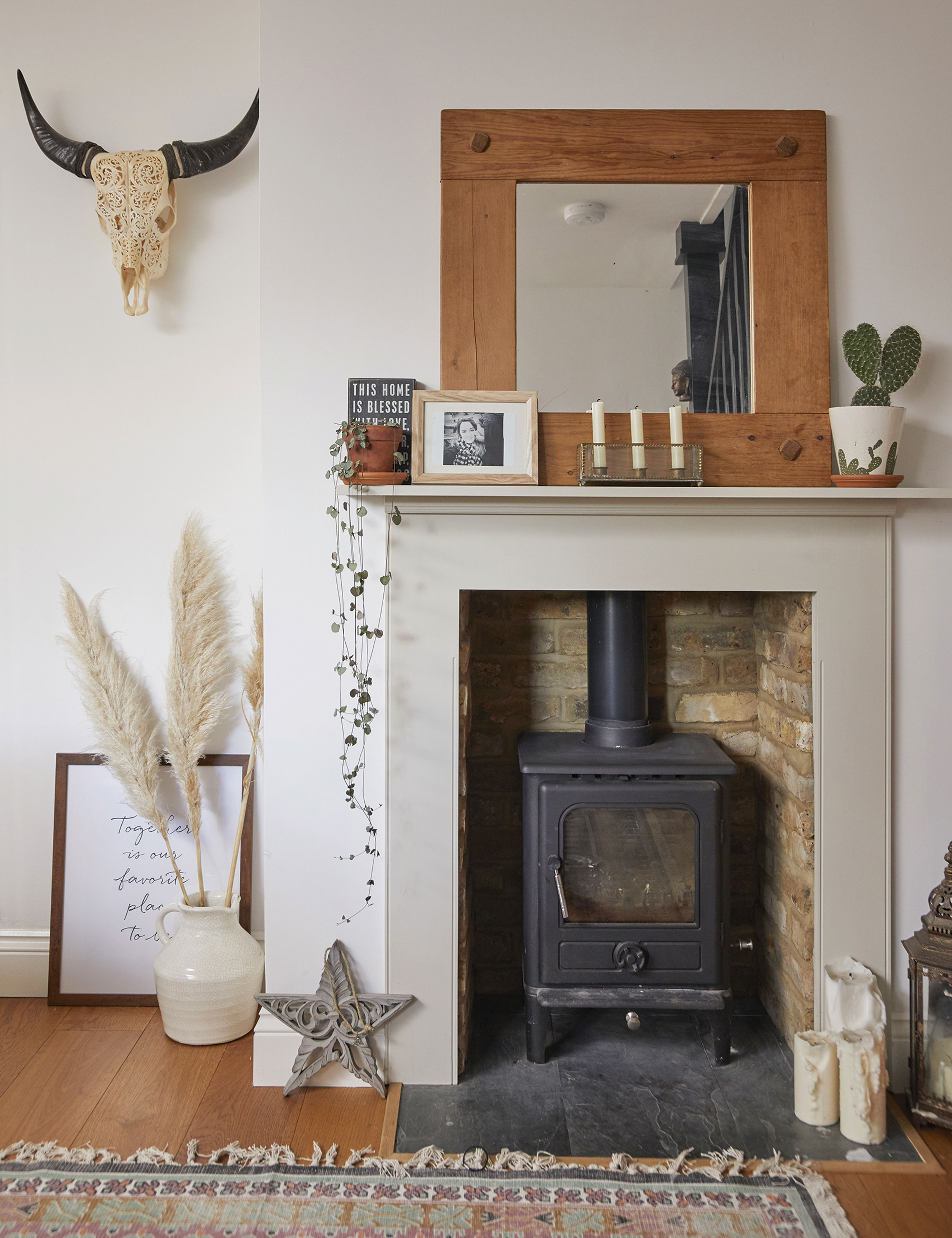 ‘I installed the log-burner and a new hearth when I did the floors before we moved in. I love styling this area with plants and accessories, and swapping my mirrors around to give it a fresh new look’