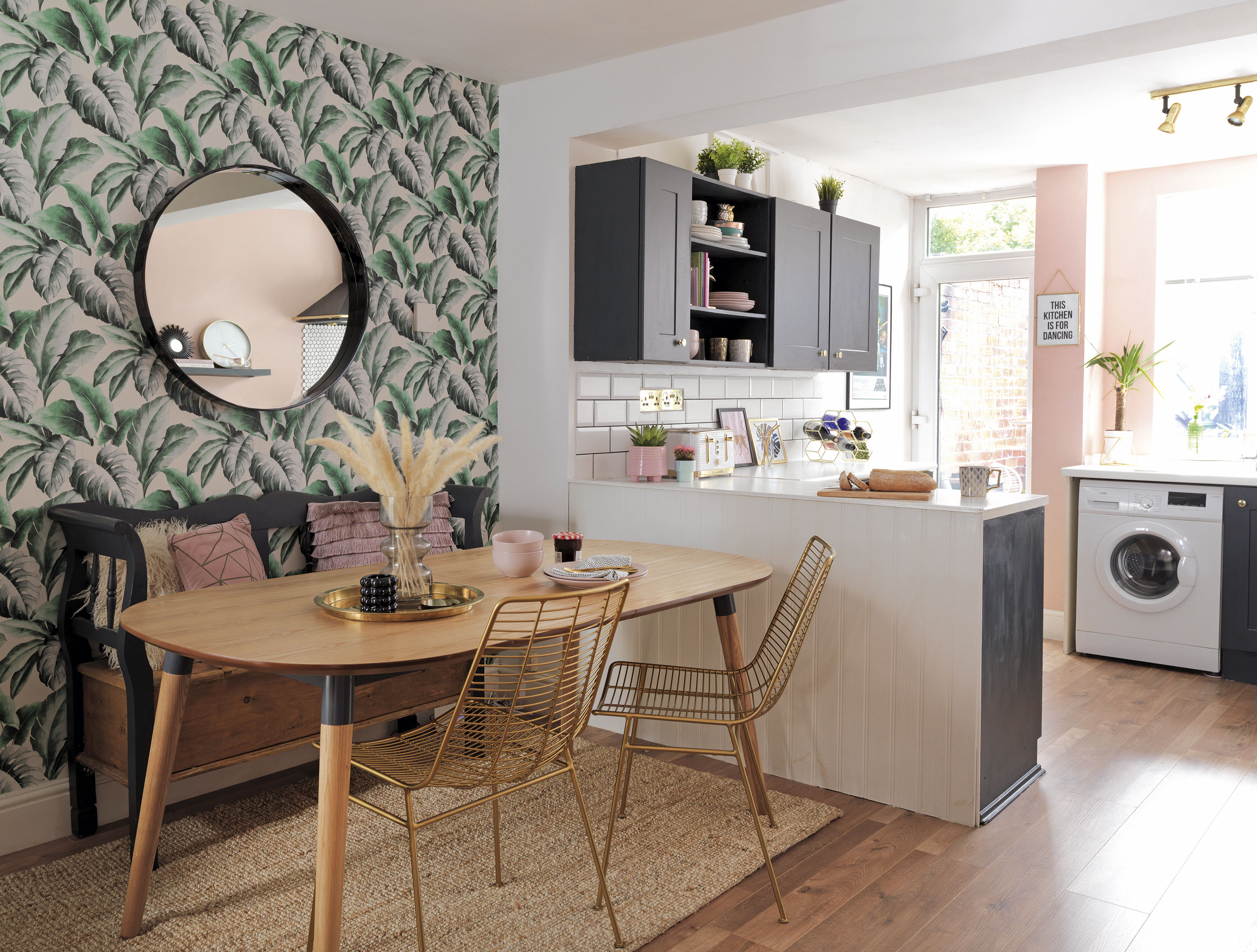 'Our home is cool & quirky with a bit of edge' ‘Our dining table and chairs are from MADE.com, while our dining room wallpaper is from I Love Wallpaper,’ says Raya. ‘It worked well with the green and pink colours we were looking at for the room and we thought it was quite bold and eye-catching’