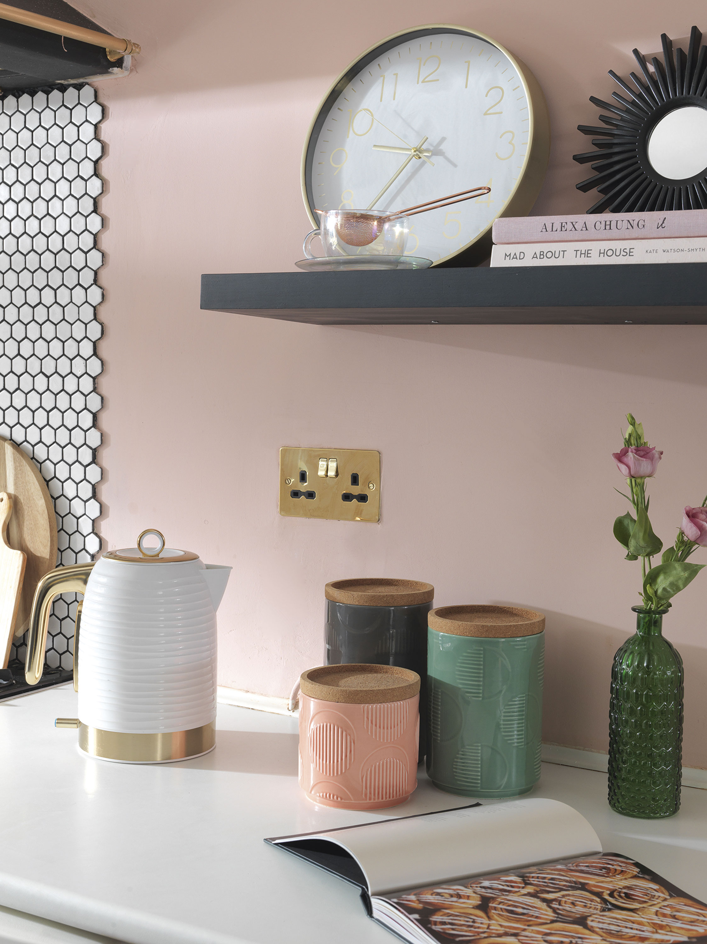 'Our home is cool & quirky with a bit of edge' On the opposite kitchen wall, Raya chose Valspar’s Pink Perfection. She has a shelf next to the cooker where she displays some non-kitchen items to keep it feeling decorative