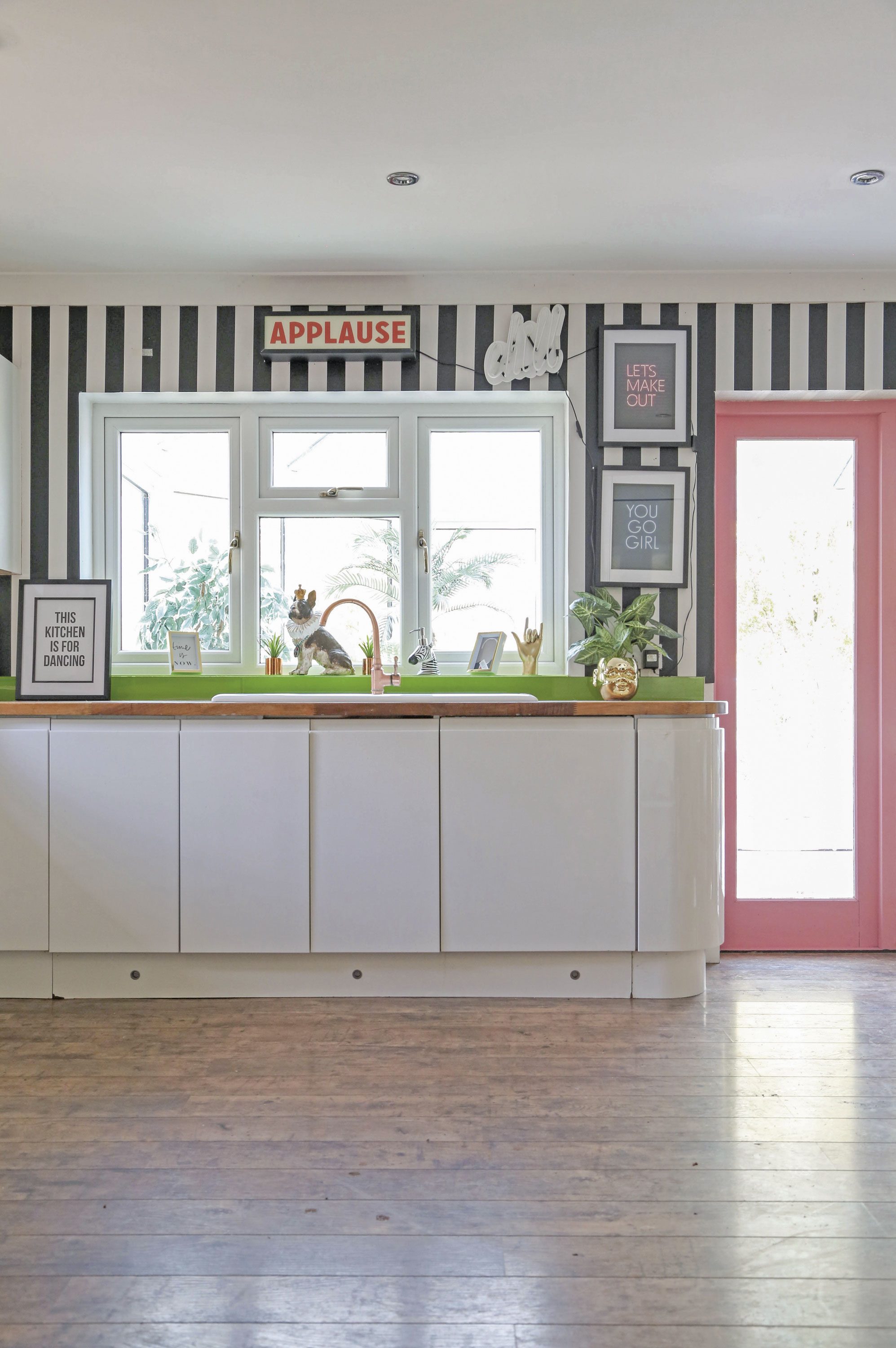 ‘We had a new kitchen fitted by Magnet, and new French doors leading into the conservatory,’ Hayley explains. ‘Now, it’s so much more spacious and streamlined.’ Not one to miss an opportunity for bold colour, Hayley went for a door frame in a bubblegum pink ‘We had a new kitchen fitted by Magnet, and new French doors leading into the conservatory,’ Hayley explains. ‘Now, it’s so much more spacious and streamlined.’ Not one to miss an opportunity for bold colour, Hayley went for a door frame in a bubblegum pink