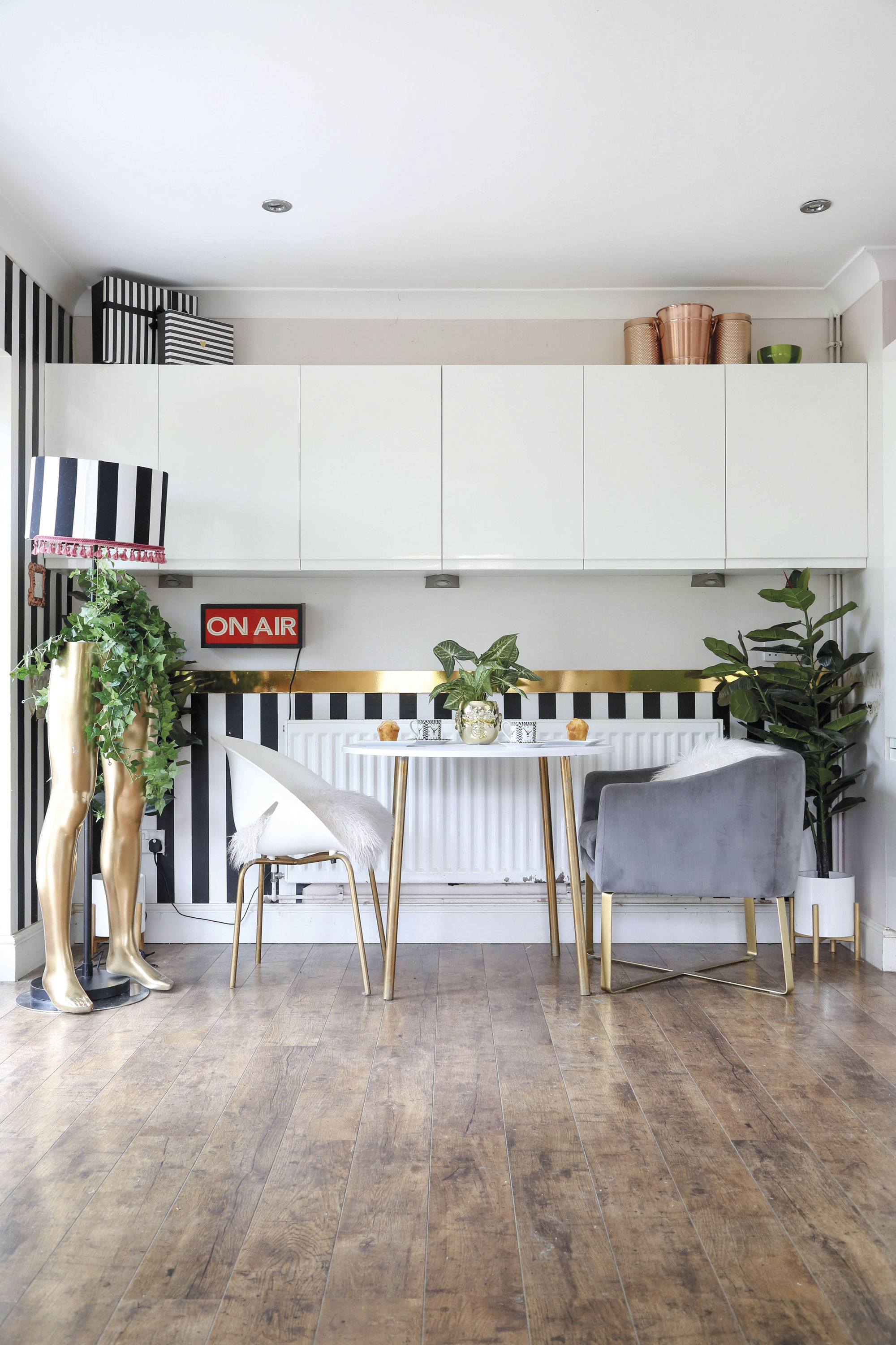 ‘I found the mannequin legs in a junkyard and decided to spray-paint them gold to create a fun feature,’ says Hayley. ‘The striped monochrome wallpaper was a bargain buy from Wilko’