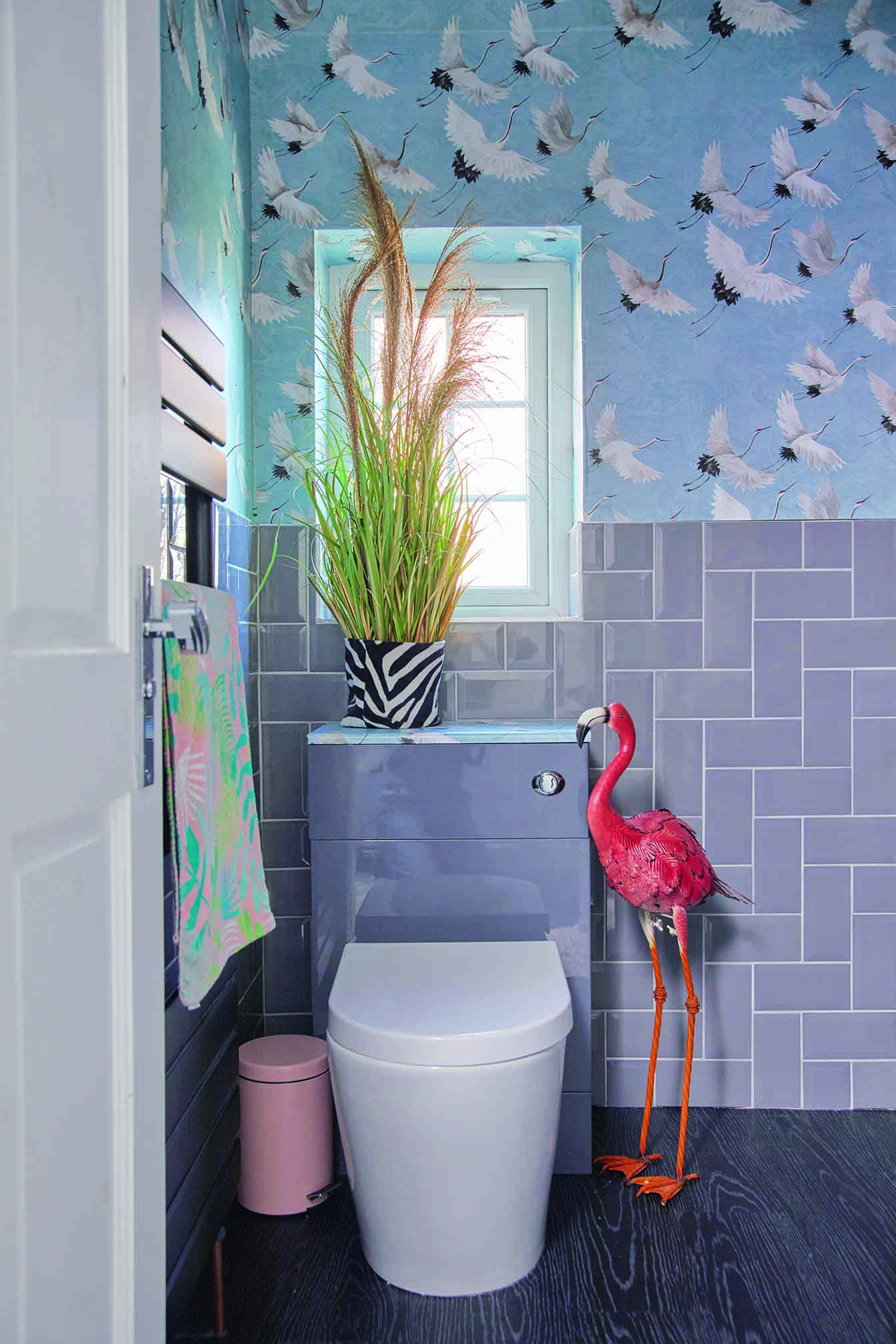 Emily's bathroom features a crane wallpaper