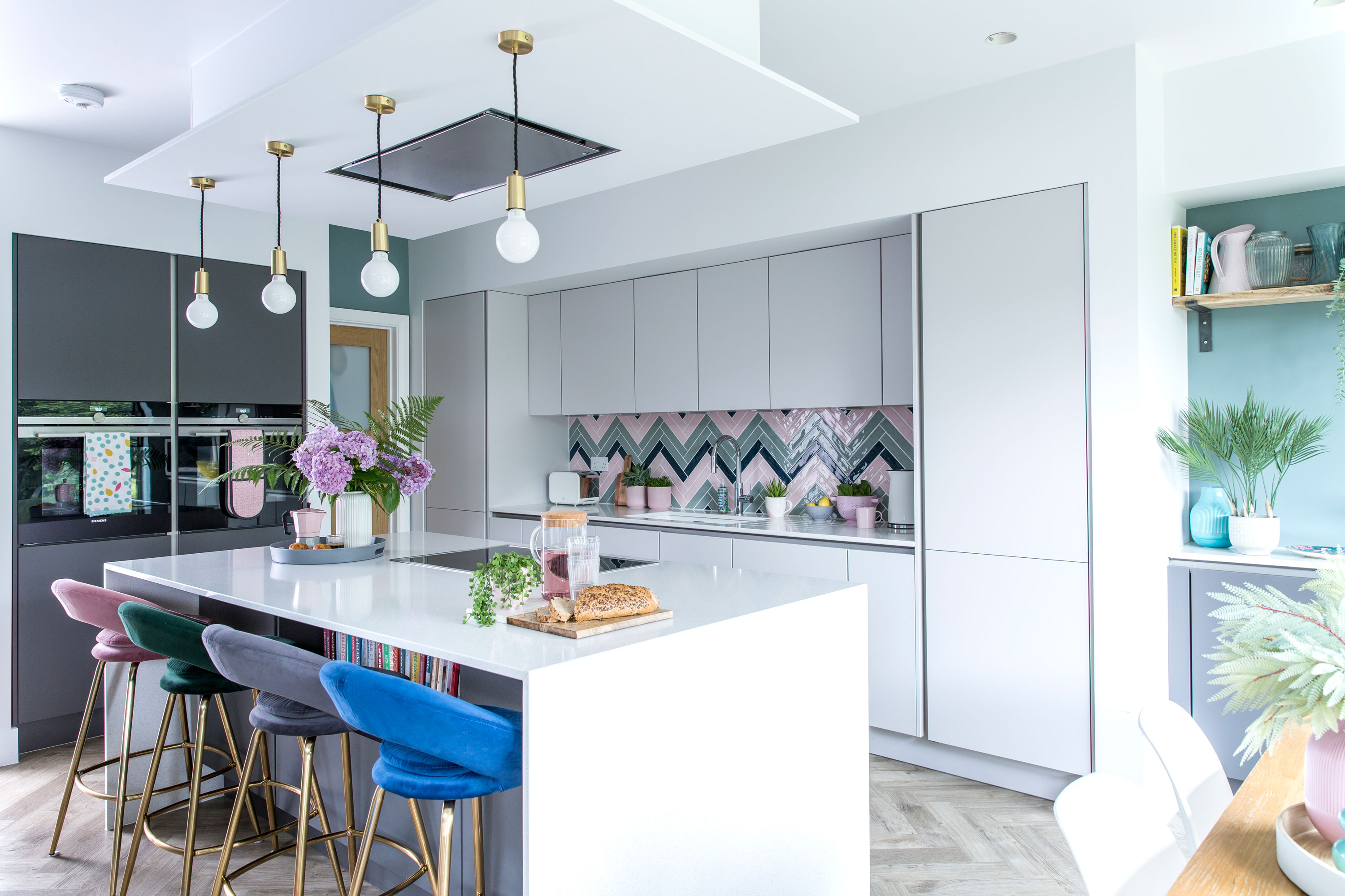 Good idea! Create your own vibrant splashback with a herringbone pattern but do a rough sketch for your tiler so there are no misunderstandings