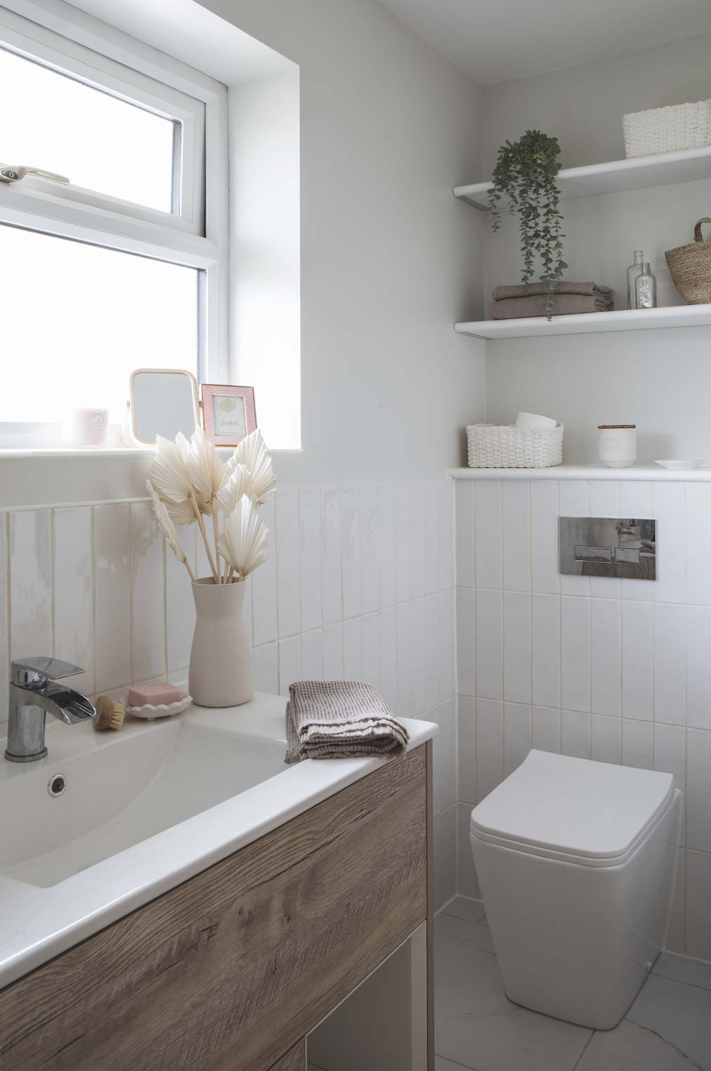 As the rest of her bathroom scheme is white and marble, Becca added warmth with natural tones. ‘I wanted a textured vanity in a colour contrast with the white tiles and fell in love with this wood-effect style for its Scandi look,’ says Becca As the rest of her bathroom scheme is white and marble, Becca added warmth with natural tones. ‘I wanted a textured vanity in a colour contrast with the white tiles and fell in love with this wood-effect style for its Scandi look,’ says Becca