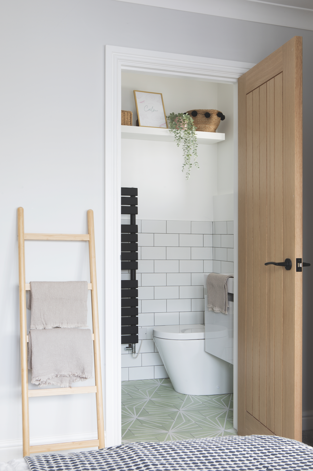 Becca has packed a lot of style into the petite en suite – black accents echo the décor throughout her home, while green floor tiles match the bedroom walls for a sense of flow between the two rooms Becca has packed a lot of style into the petite en suite – black accents echo the décor throughout her home, while green floor tiles match the bedroom walls for a sense of flow between the two rooms