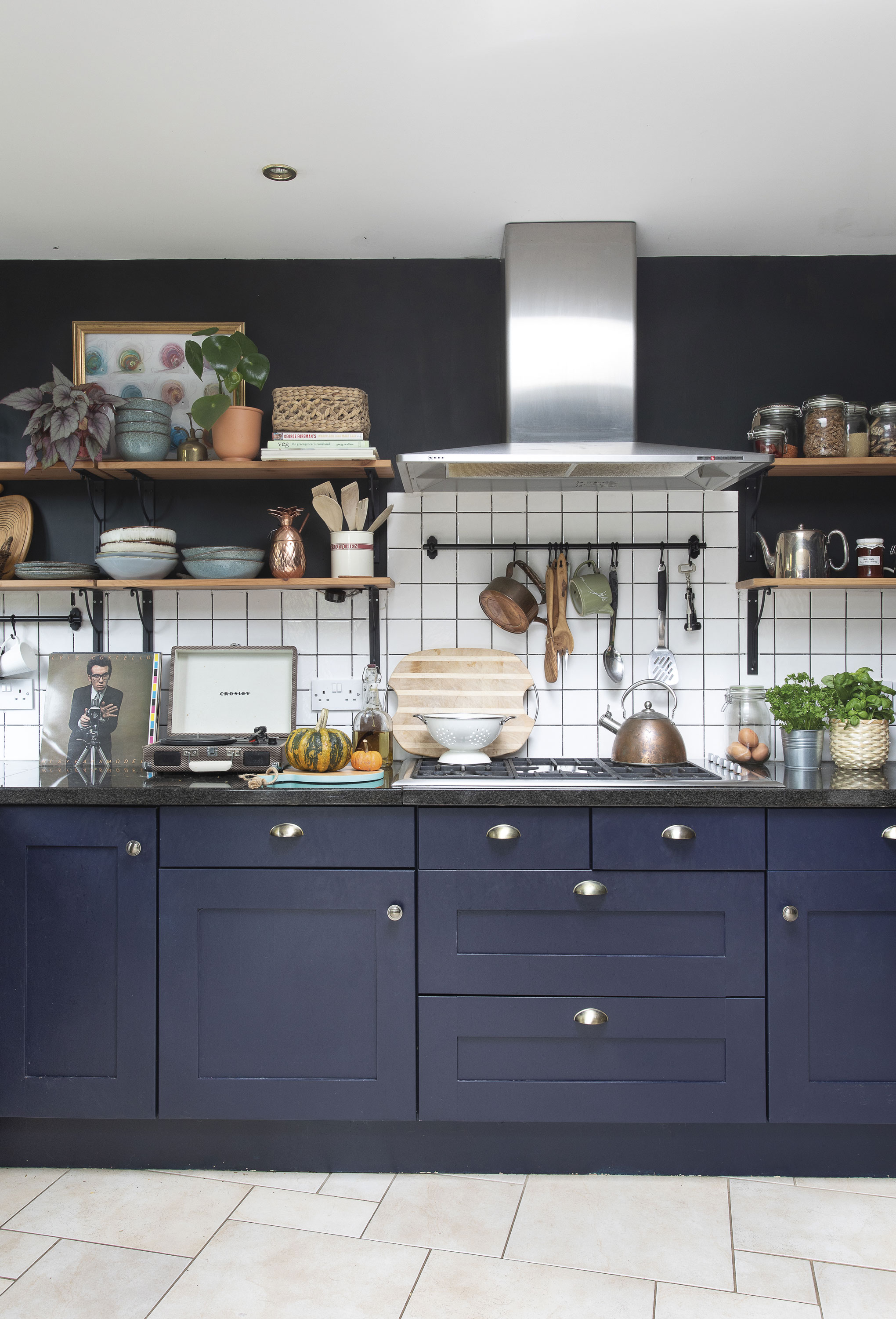 The cabinets were already here, and Eniko gave them a new look by painting them in Marine Blue by Little Greene. The dark brown walls are painted in Mole emulsion by Abigail Ahern. ‘I removed the wall cabinets and replaced them with open shelving. Blackboard walls are great for styling up Instagram moments!’ The cabinets were already here, and Eniko gave them a new look by painting them in Marine Blue by Little Greene. The dark brown walls are painted in Mole emulsion by Abigail Ahern. ‘I removed the wall cabinets and replaced them with open shelving. Blackboard walls are great for styling up Instagram moments!’
