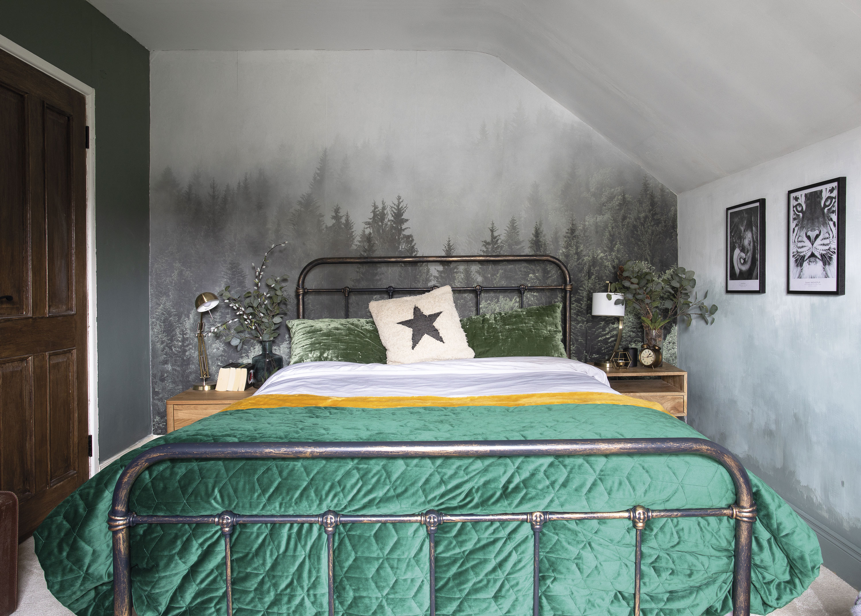 The mural is from a Californian company called Rocky Mountains Decal. Eniko created the ombré walls using Green Smoke estate emulsion by Farrow & Ball. The velvet pillows are from H&M, and the fluffy yellow throw and emerald quilt are from The Conran Shop. Eniko bought the vintage-style metal bed on Amazon. The Wayfair bedside tables are styled with lamps from Laura Ashley The mural is from a Californian company called Rocky Mountains Decal. Eniko created the ombré walls using Green Smoke estate emulsion by Farrow & Ball. The velvet pillows are from H&M, and the fluffy yellow throw and emerald quilt are from The Conran Shop. Eniko bought the vintage-style metal bed on Amazon. The Wayfair bedside tables are styled with lamps from Laura Ashley