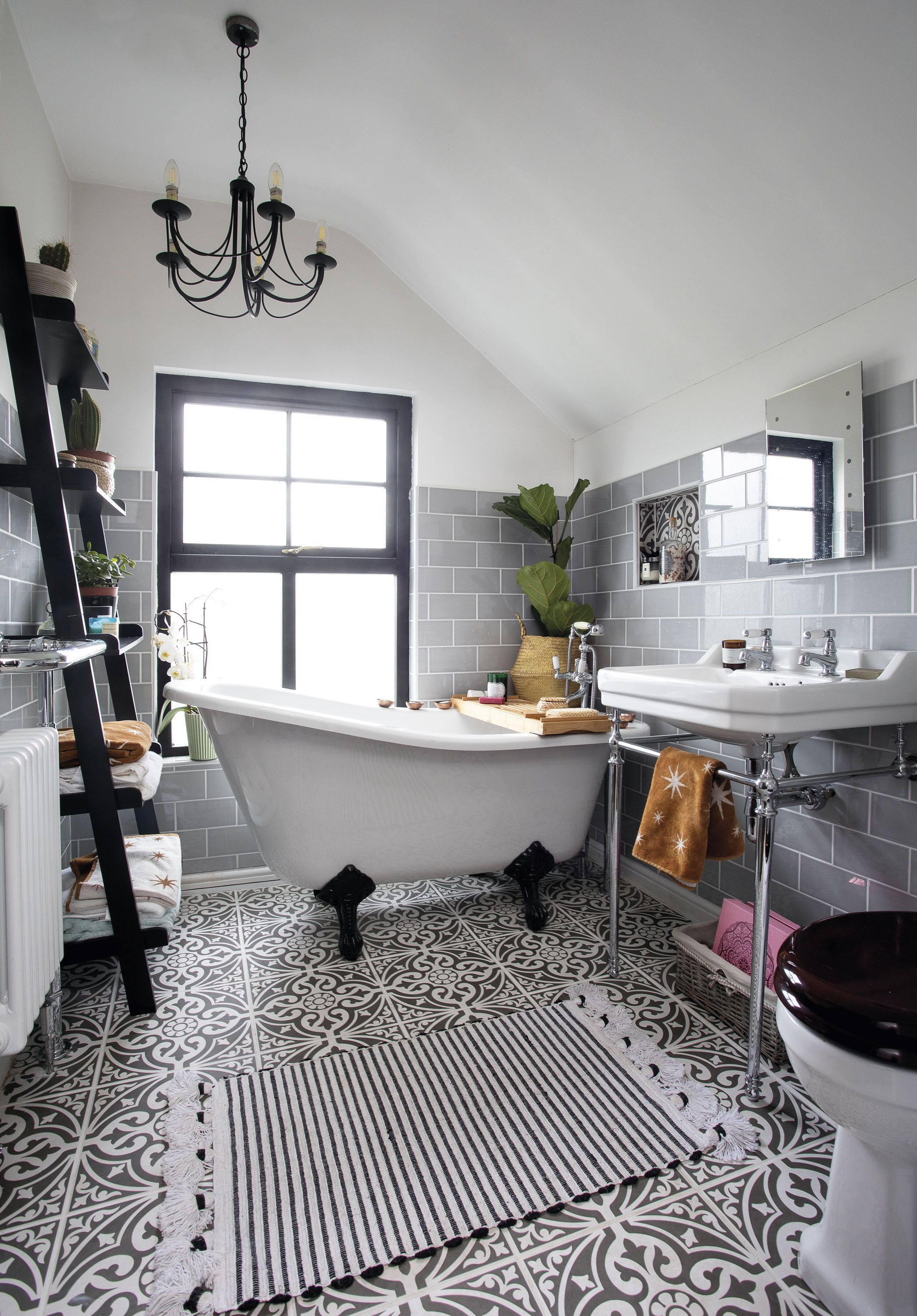 Eniko mixed modern and traditional in the bathroom, with Moroccan-style patterned tiles by British Ceramic Tile, a classic bath by Victoria Plum, and a ladder shelving unit from Amazon. The wooden bath rack is by The Wolf & The Fox, which specialises in sustainable products Eniko mixed modern and traditional in the bathroom, with Moroccan-style patterned tiles by British Ceramic Tile, a classic bath by Victoria Plum, and a ladder shelving unit from Amazon. The wooden bath rack is by The Wolf & The Fox, which specialises in sustainable products