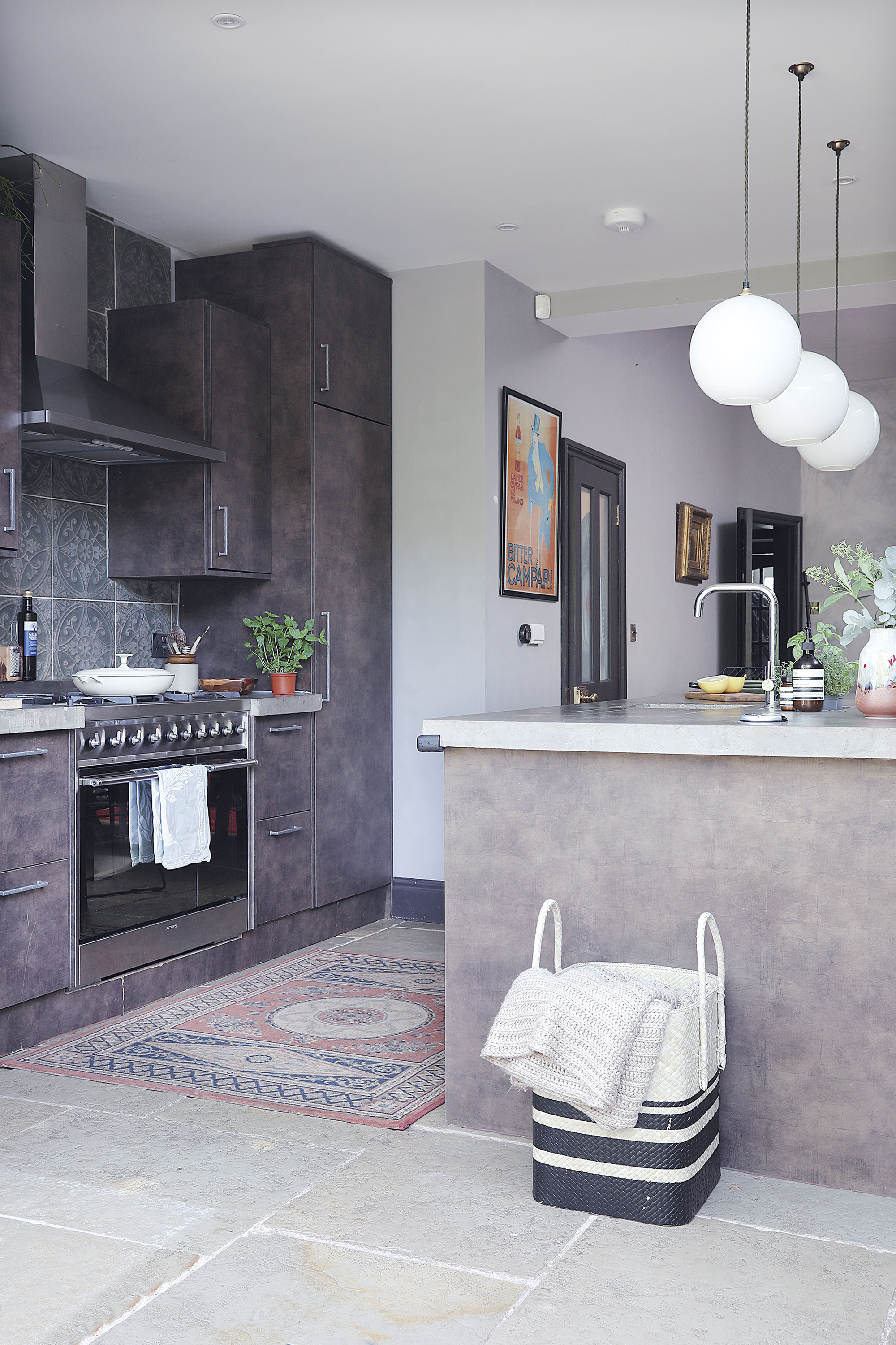 Home makeover: 'Our style is a modern take on traditional' ‘As we overlook fields and trees at the back, I wanted the kitchen to reflect the natural colours outside. I love dark colours but didn’t want it on the walls, so we opted for kitchen doors with brown and bronze tones instead’