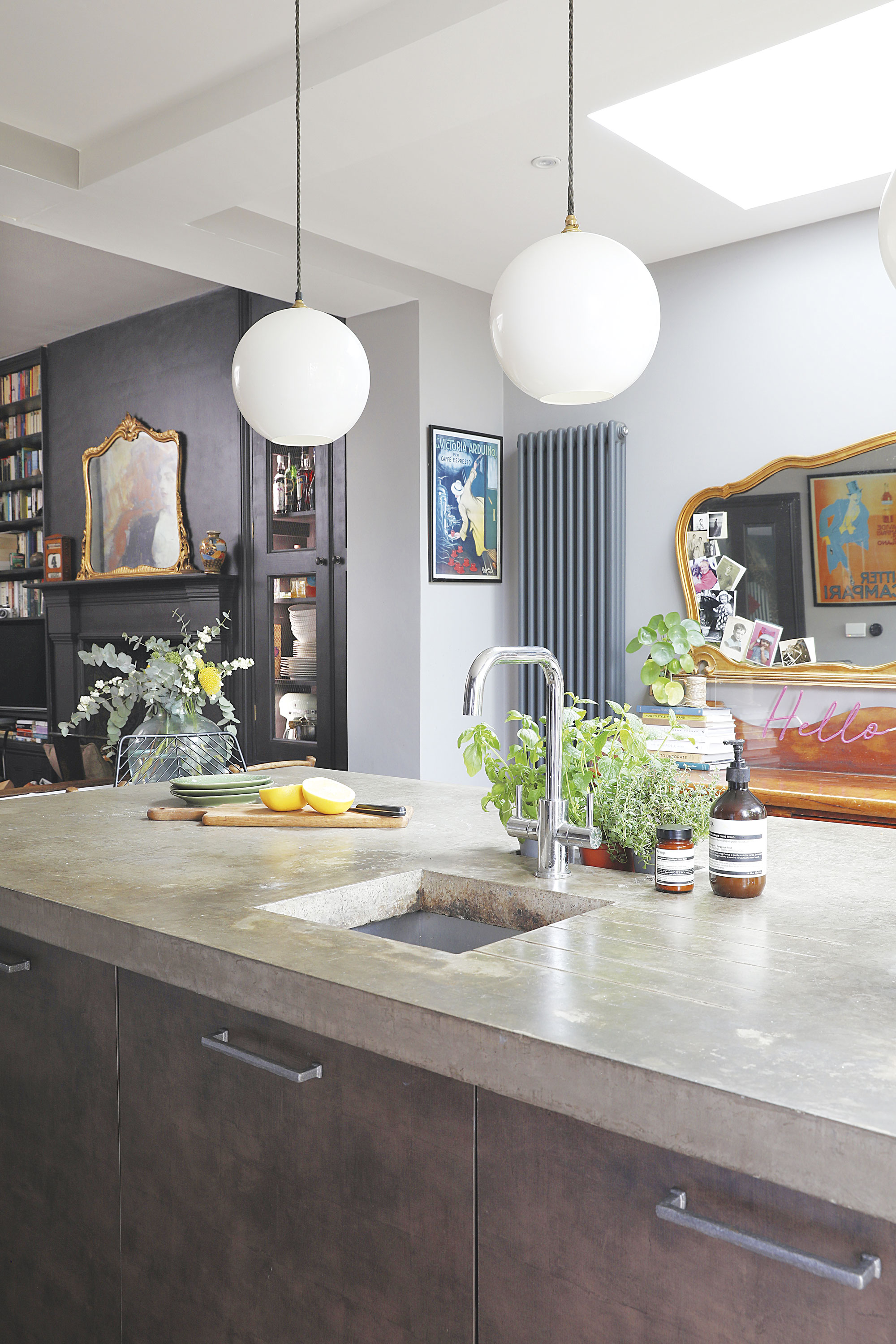 Home makeover: 'Our style is a modern take on traditional' ‘I had always wanted concrete worktops, but when we were quoted £8,000 for them my husband made wooden frames and did it himself for around £800. The pendant lights are from Pooky’