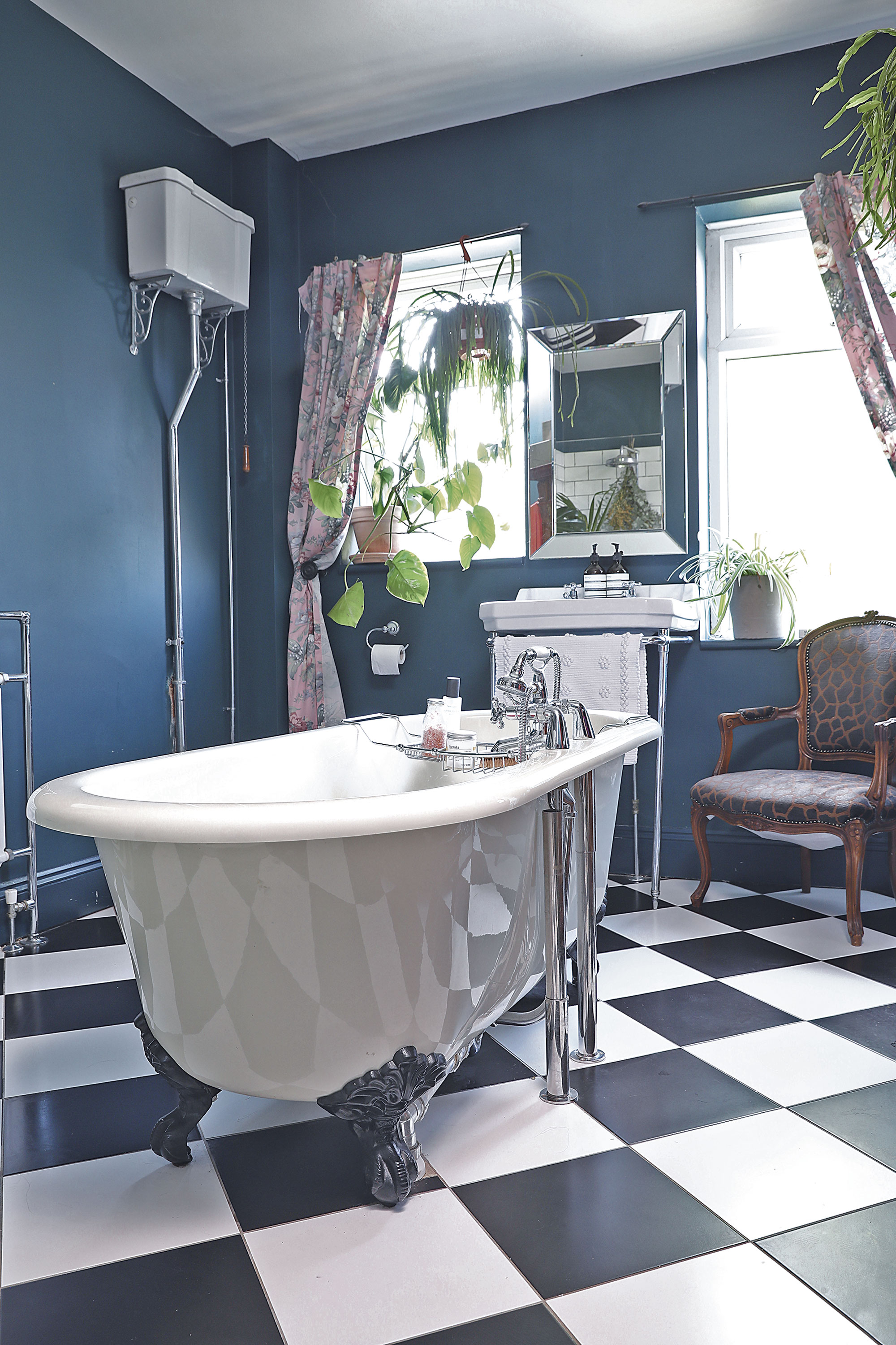 Home makeover: 'Our style is a modern take on traditional' ‘I wanted the bathroom to look very Victorian with the high cistern toilet, monochrome flooring and vintage curtains. We chose Hague Blue by Farrow & Ball for the walls as the room’s so big and light, it can take it’