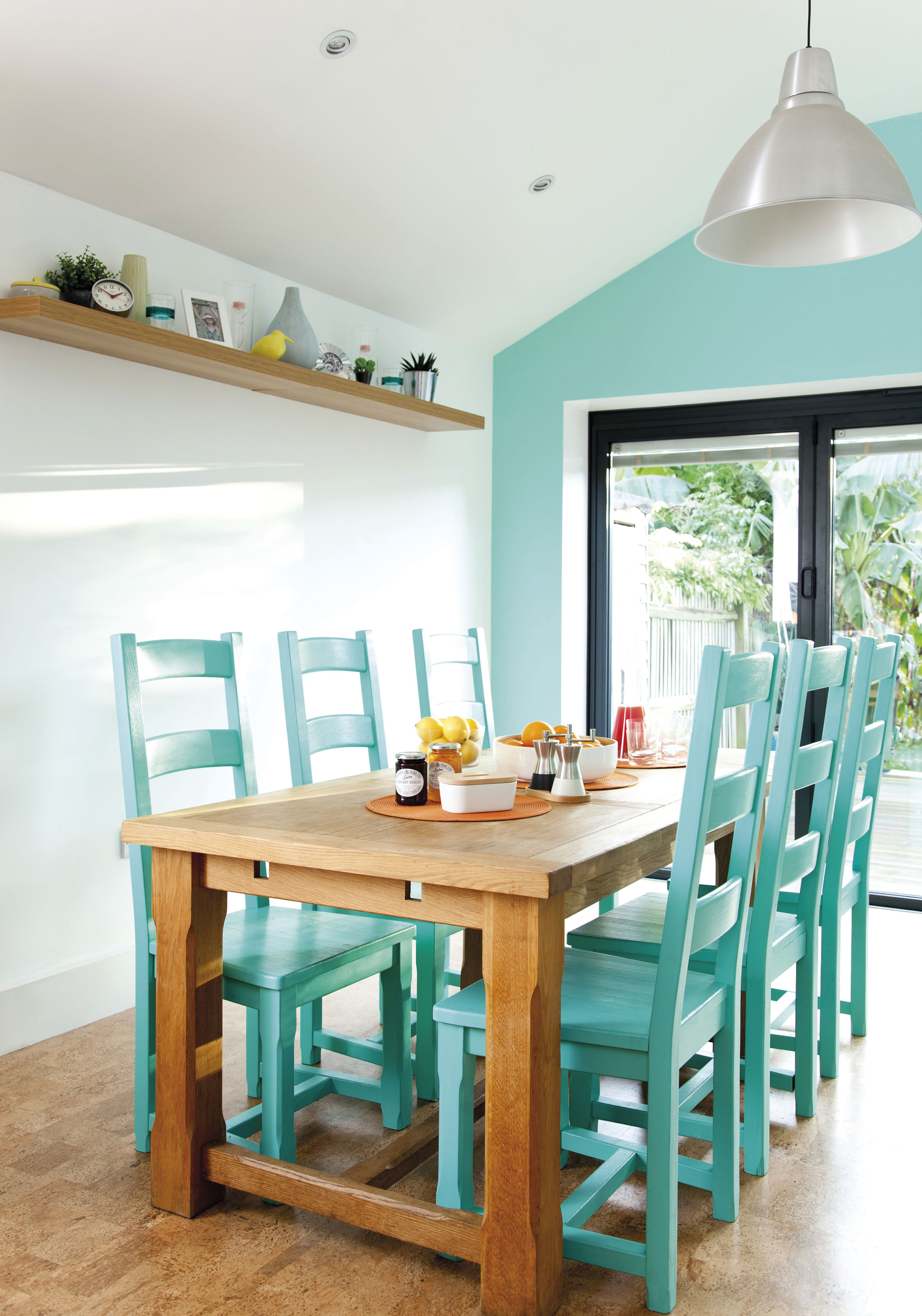 Bev’s chairs were looking tired so she painted them a fresh blue-green, which, when teamed with orange, gives the room a summery, tropical feel Bev’s chairs were looking tired so she painted them a fresh blue-green, which, when teamed with orange, gives the room a summery, tropical feel