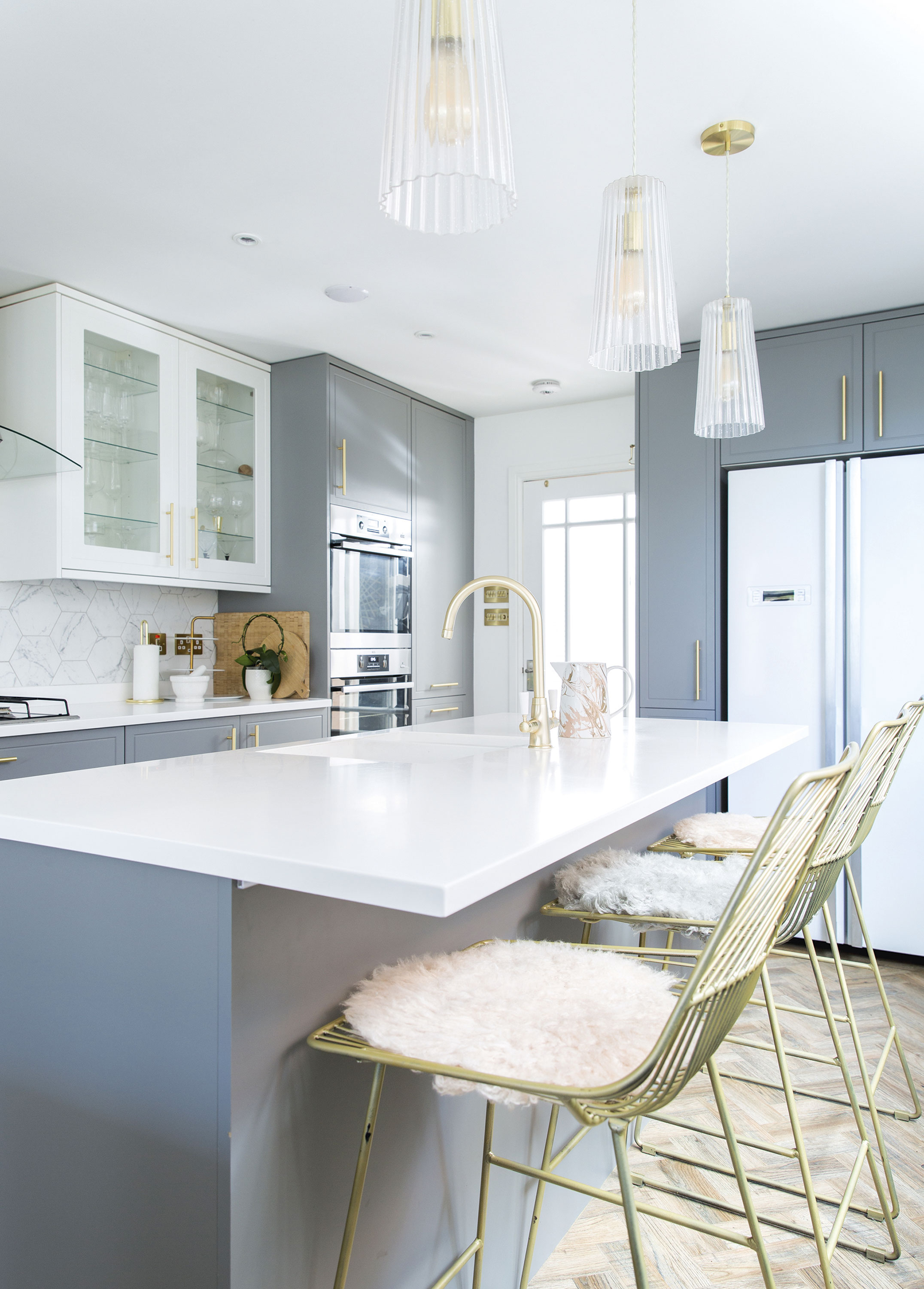 Lindsey sprayed the breakfast bar stools gold to tie in with other metallic elements in the kitchen. The pale blush sheepskin cushions were picked out to match with the pink toaster and kettle Home makeover: 'I knew it would be the perfect home'