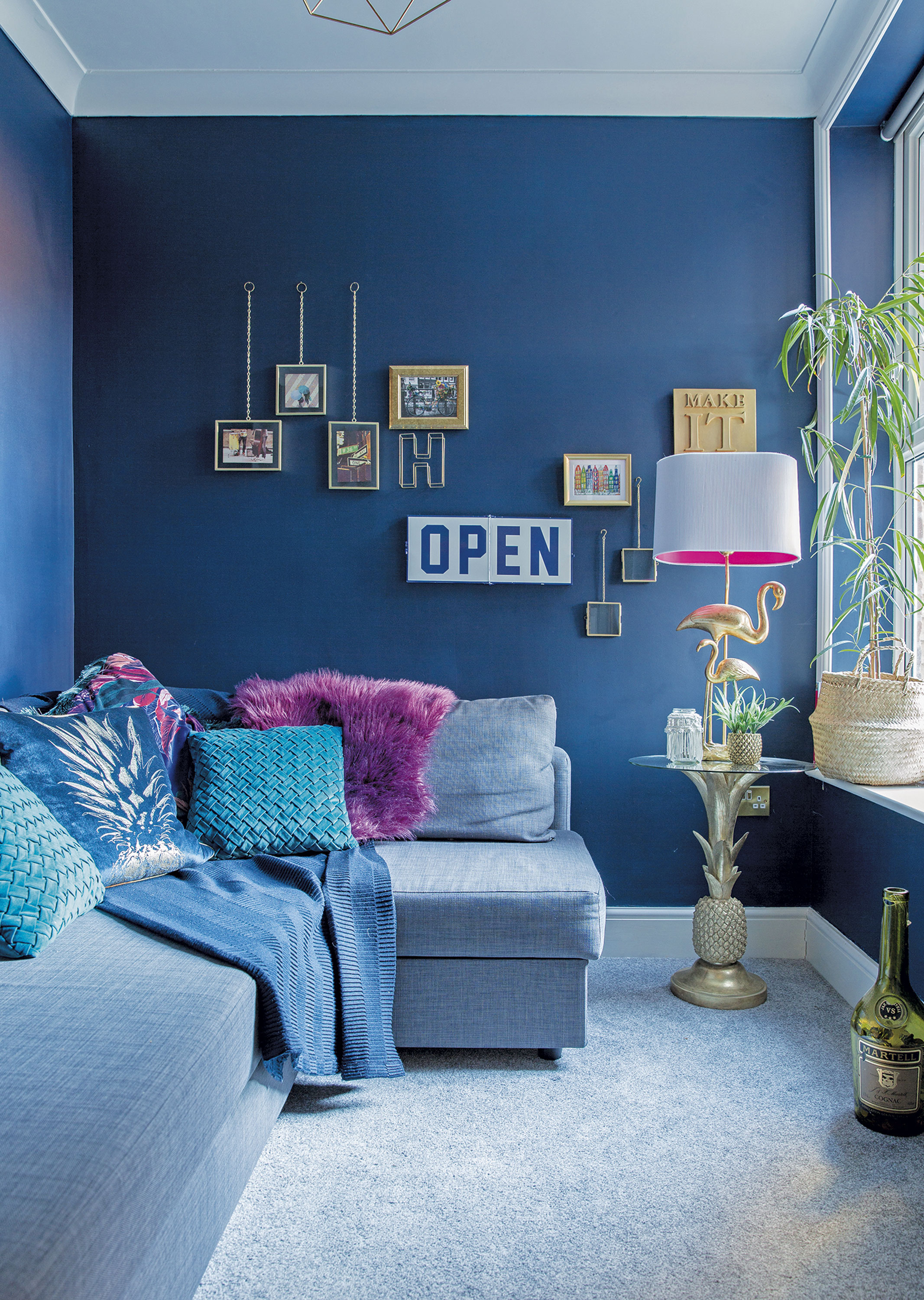 ‘The snug is the only room that has a really bright splash of colour. It’s perfect for watching movies and snuggling up. I bought the velvet cushions and throws in Primark and created a small gallery wall with some copper and brass hanging frames from HomeSense’ Home makeover: 'I knew it would be the perfect home'