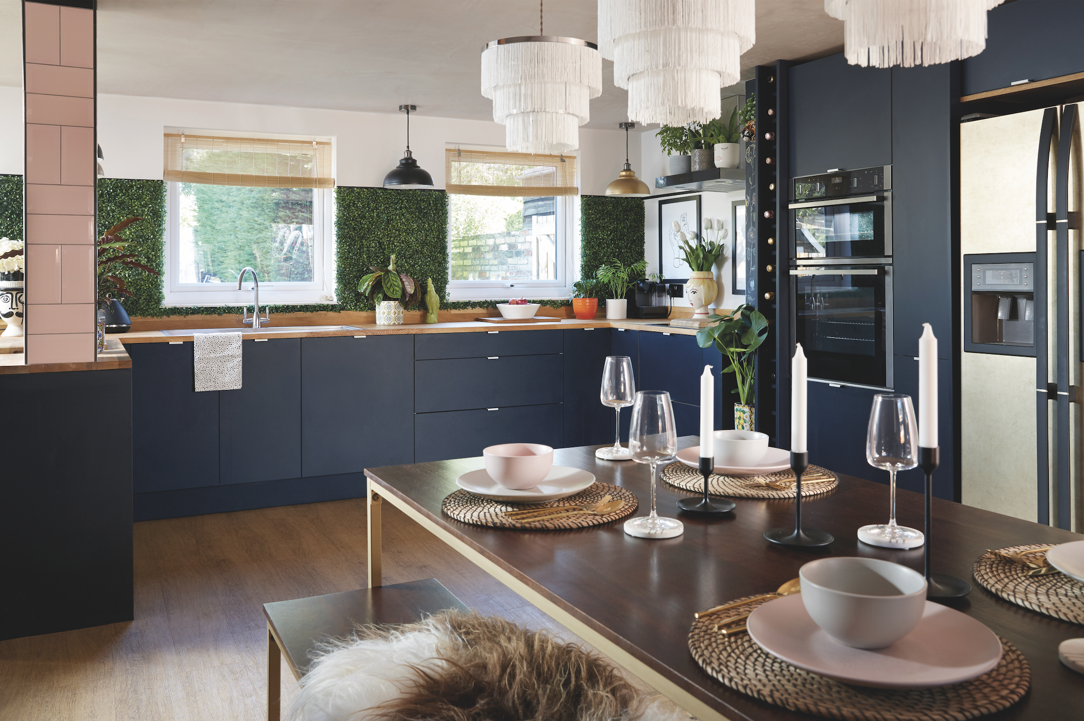 Screenshot 2020-12-08 at 15.27.06 The couple complemented the dark navy-blue units with natural oak worktops and flooring