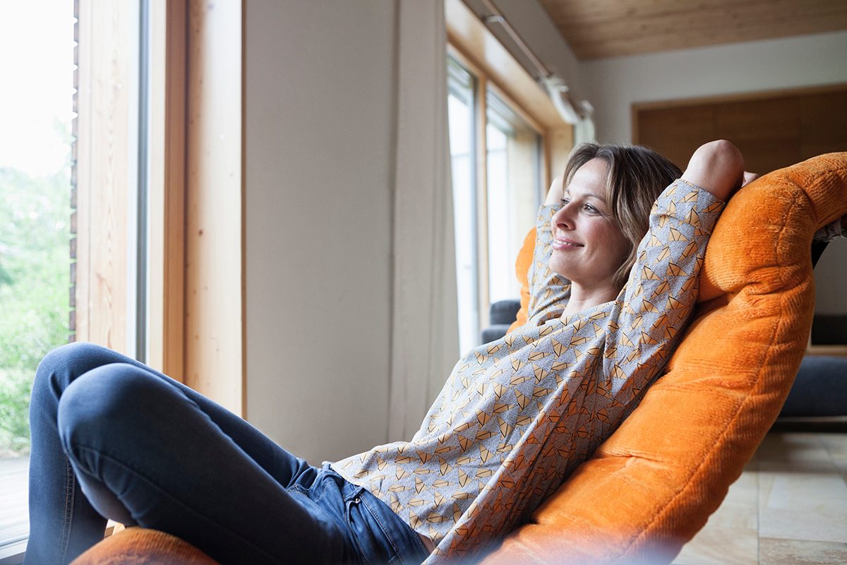Woman relaxing on a recliner chair