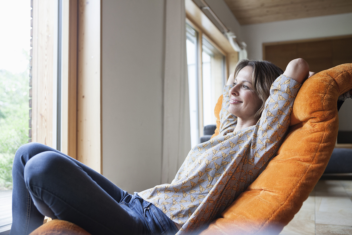 Woman relaxing on a recliner chair