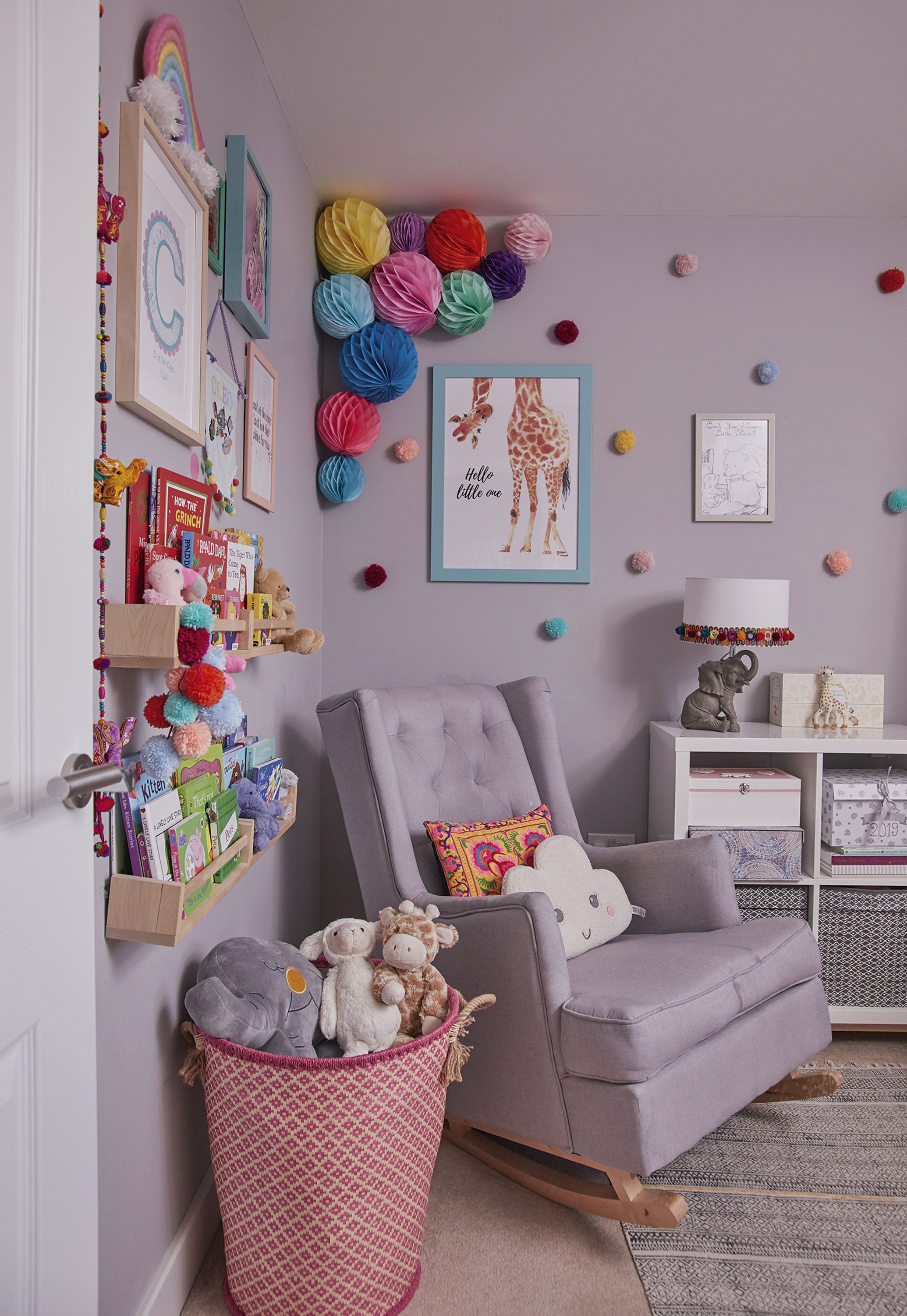 ‘This book storage is actually a repurposed spice rack. I created another gallery wall above it, especially for Cleo. The Hathi elephant table lamp is from Home Essentials’