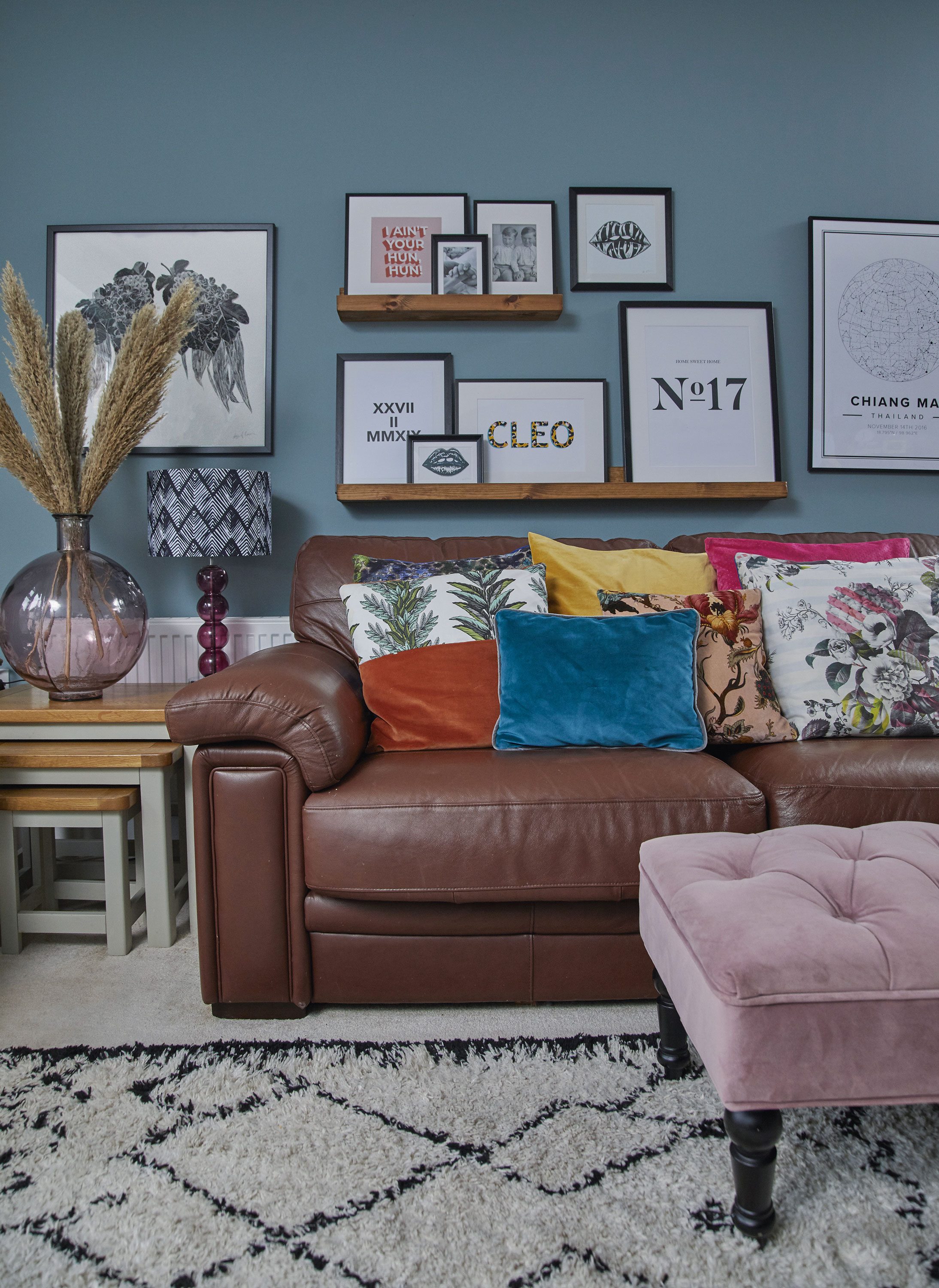 ‘Putting up the simple IKEA shelves gave me a chance to display the photographs and prints we’ve collected over the years. I particularly love the Cleo print, from Ivy Print Design. I got the leather sofa from my grandparents’