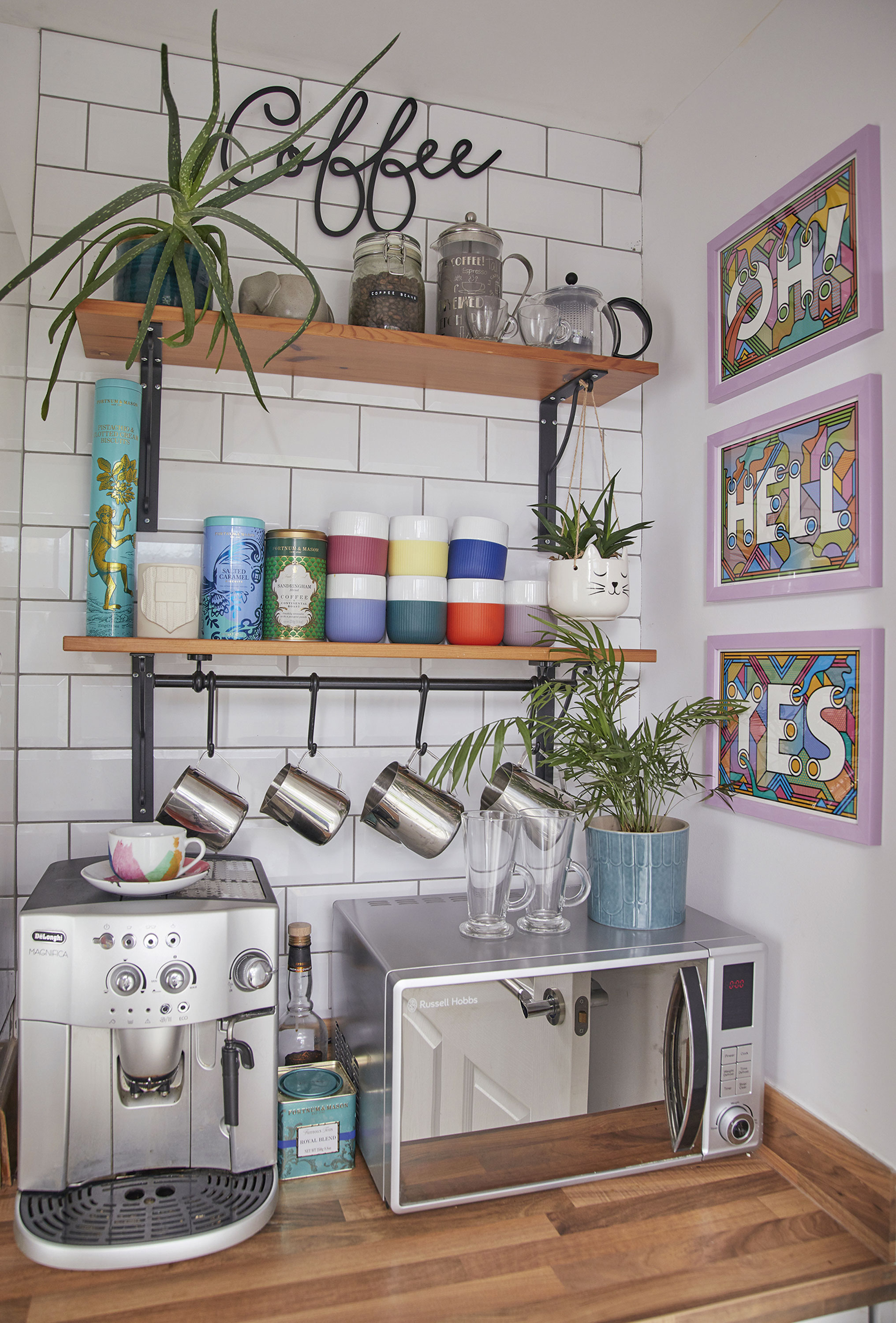 ‘We call this our ‘Caffeine Station’. This was meant to be a utility room, but we both love coffee so we decided to make it into an area that would brighten our mornings. The ‘Oh Hell Yes’ prints are by the illustrator Rob Lowe’ ‘We call this our ‘Caffeine Station’. This was meant to be a utility room, but we both love coffee so we decided to make it into an area that would brighten our mornings. The ‘Oh Hell Yes’ prints are by the illustrator Rob Lowe’