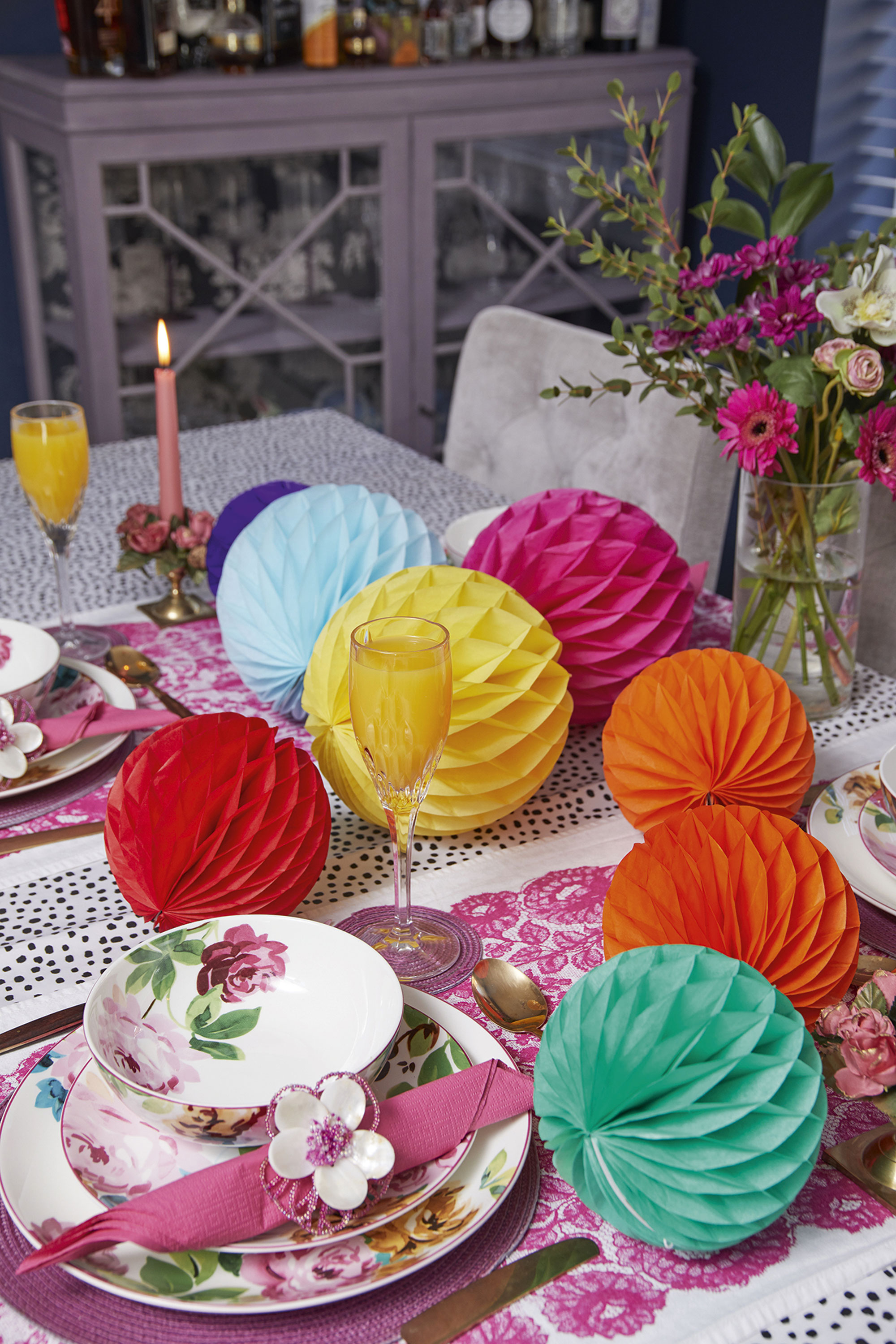 ‘I love creating a tablescape, which of course usually includes a paper pompom or two. Layering up these pretty dishes from M&S with simple paper napkins adds the finishing touch’ ‘I love creating a tablescape, which of course usually includes a paper pompom or two. Layering up these pretty dishes from M&S with simple paper napkins adds the finishing touch’
