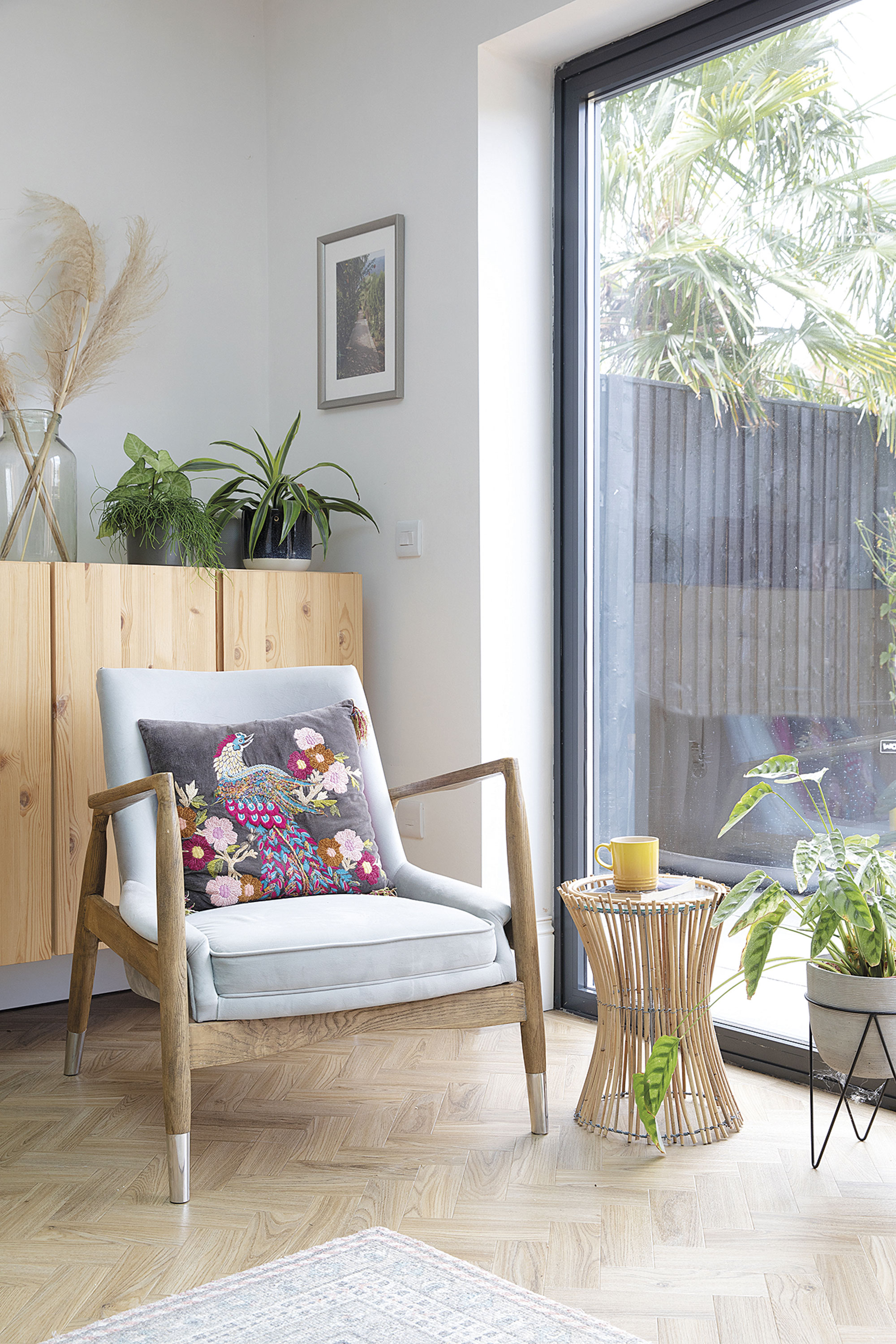 ‘The chair and cushion are from HomeSense – one of my favourite stores – and I found the bargain plant stand in Søstrene Grene. It makes a great little side table’