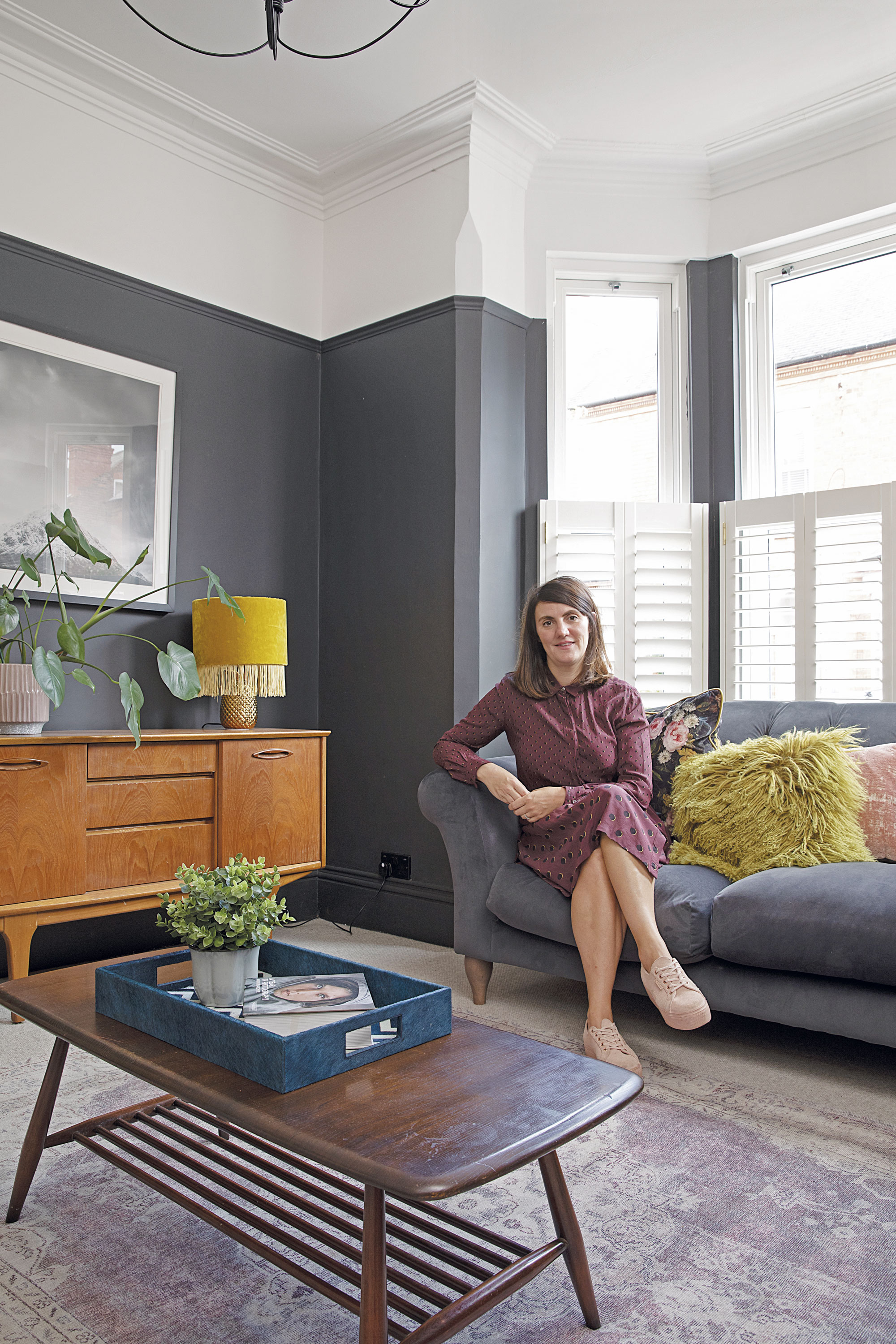 A dark wall provides the perfect backdrop for Sam’s mix of vintage and new furniture. ‘The mid-century sideboard was £25 from a charity shop and the Ercol coffee table was inherited from Gareth’s grandma,’ she says