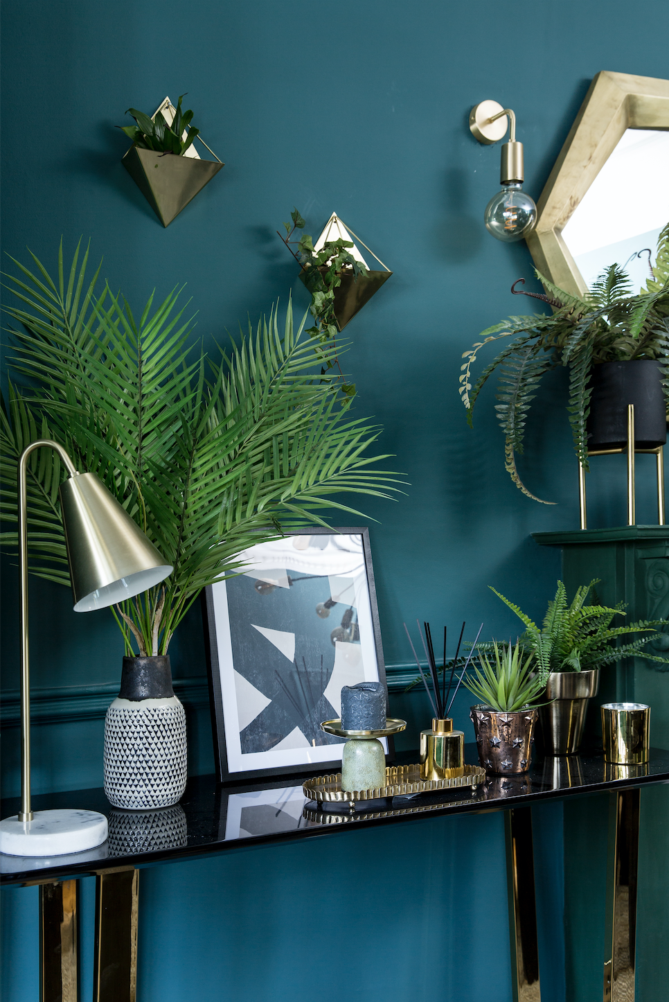 Emma’s used a dramatic dark green and black colour scheme to give her dining room a complete overhaul. The combination works to create a warm and inviting space for eating and entertaining Dining room makeover: ‘A green and black scheme has revamped the space’