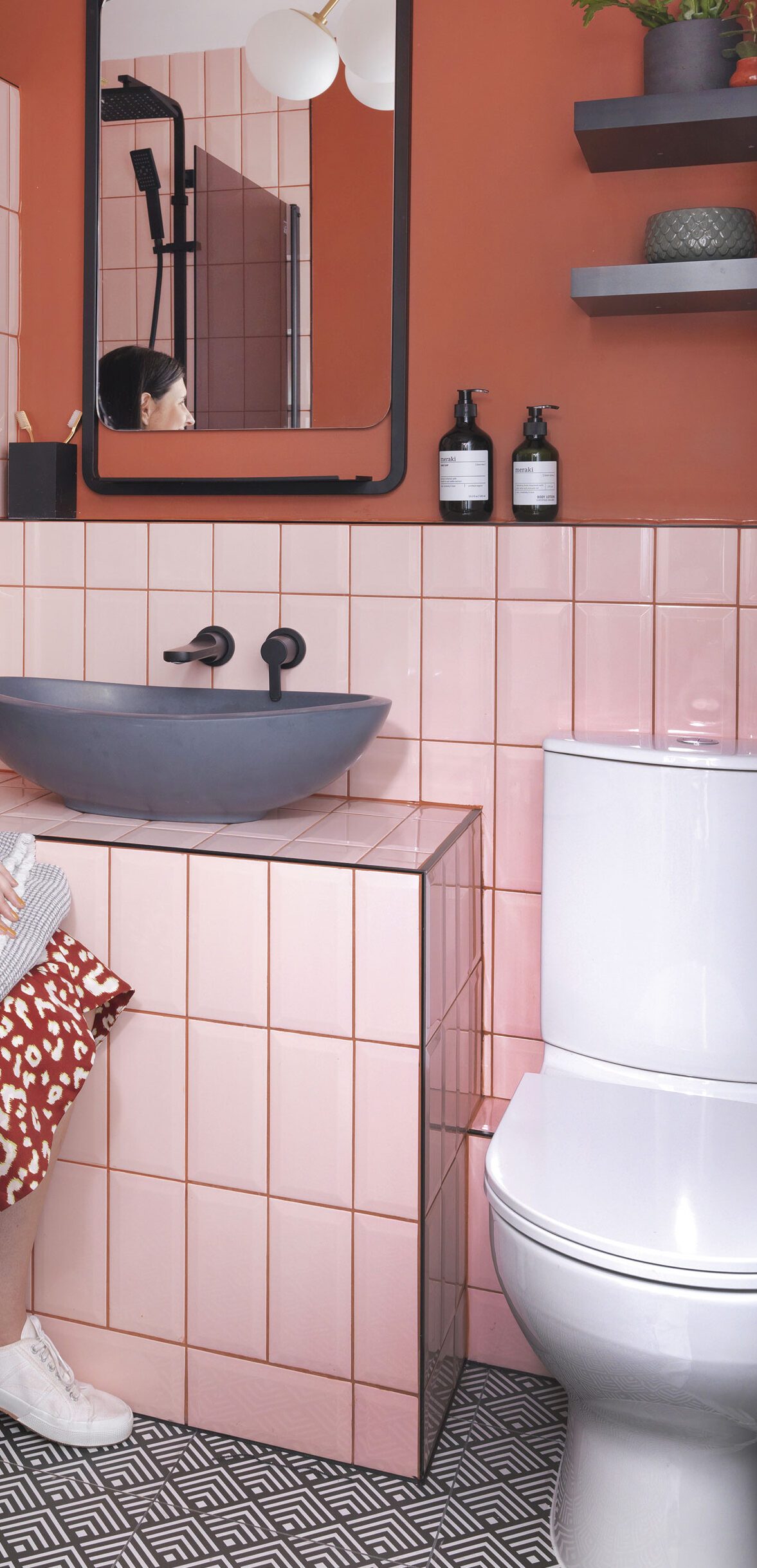 An earthy terracotta colour on the walls works perfectly against the blush metro tiles, which have been laid in a vertical formation rather than the usual brick- style pattern. A rimless loo from B&Q was chosen for its hygienic design, while the sink from BC Designs, mirror from Drench and taps from Crosswater all add a modern, sleek feel to the room. ‘I’m so pleased with how the bathroom has turned out,’ says Riannon. ‘I think the use of colours together makes a change to the standard white tiles and grey grout’ An earthy terracotta colour on the walls works perfectly against the blush metro tiles, which have been laid in a vertical formation rather than the usual brick- style pattern. A rimless loo from B&Q was chosen for its hygienic design, while the sink from BC Designs, mirror from Drench and taps from Crosswater all add a modern, sleek feel to the room. ‘I’m so pleased with how the bathroom has turned out,’ says Riannon. ‘I think the use of colours together makes a change to the standard white tiles and grey grout’