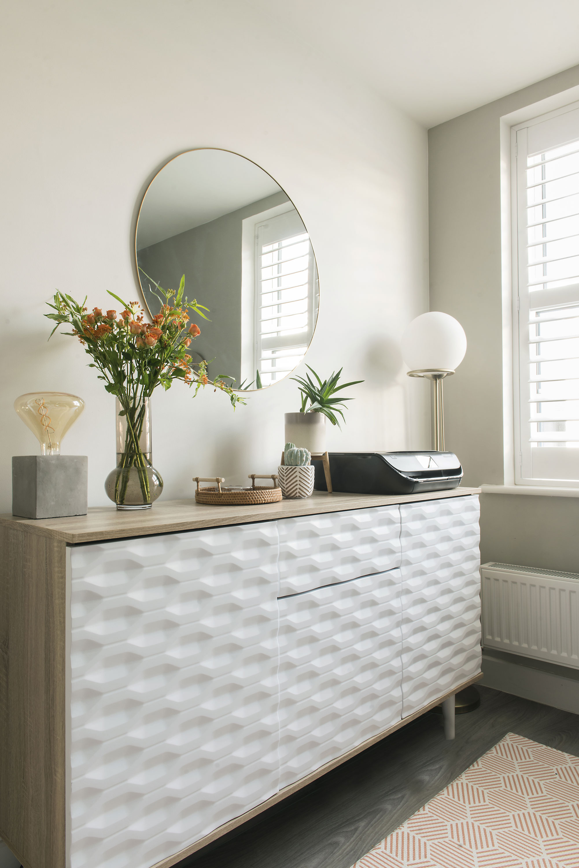 Lydia increased storage with a smart sideboard opposite the main work area. The cupboards, which have a similar, textured finish to the wall units, can take A4 files, and the neat centre drawer is perfect for stationery Lydia increased storage with a smart sideboard opposite the main work area. The cupboards, which have a similar, textured finish to the wall units, can take A4 files, and the neat centre drawer is perfect for stationery