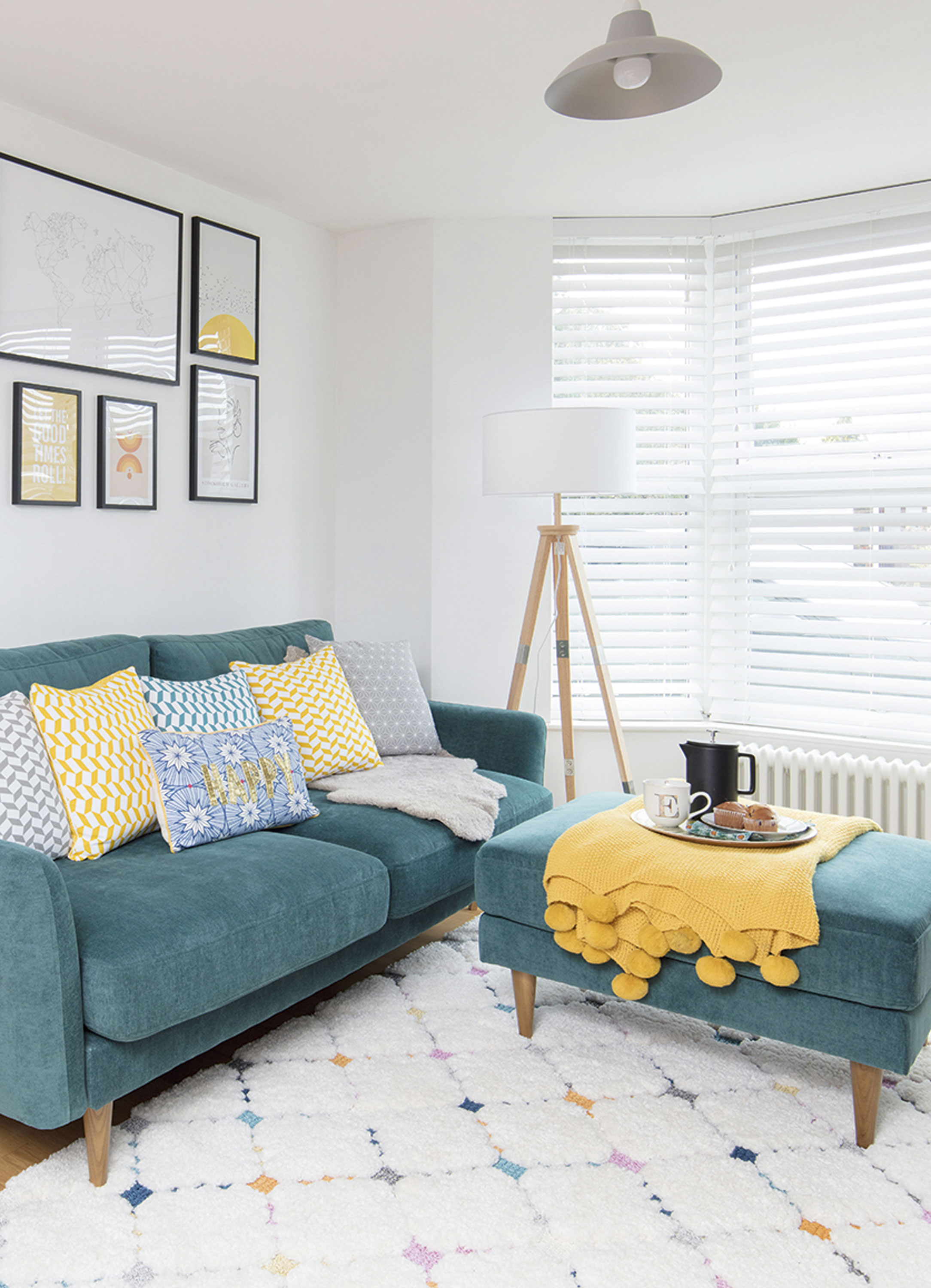 ‘I wanted our room to reflect simple Scandi design with natural wooden touches, geometric prints and blocks of colour in teal' says Erika Living room makeover: 'We were inspired by bright Scandi designs'