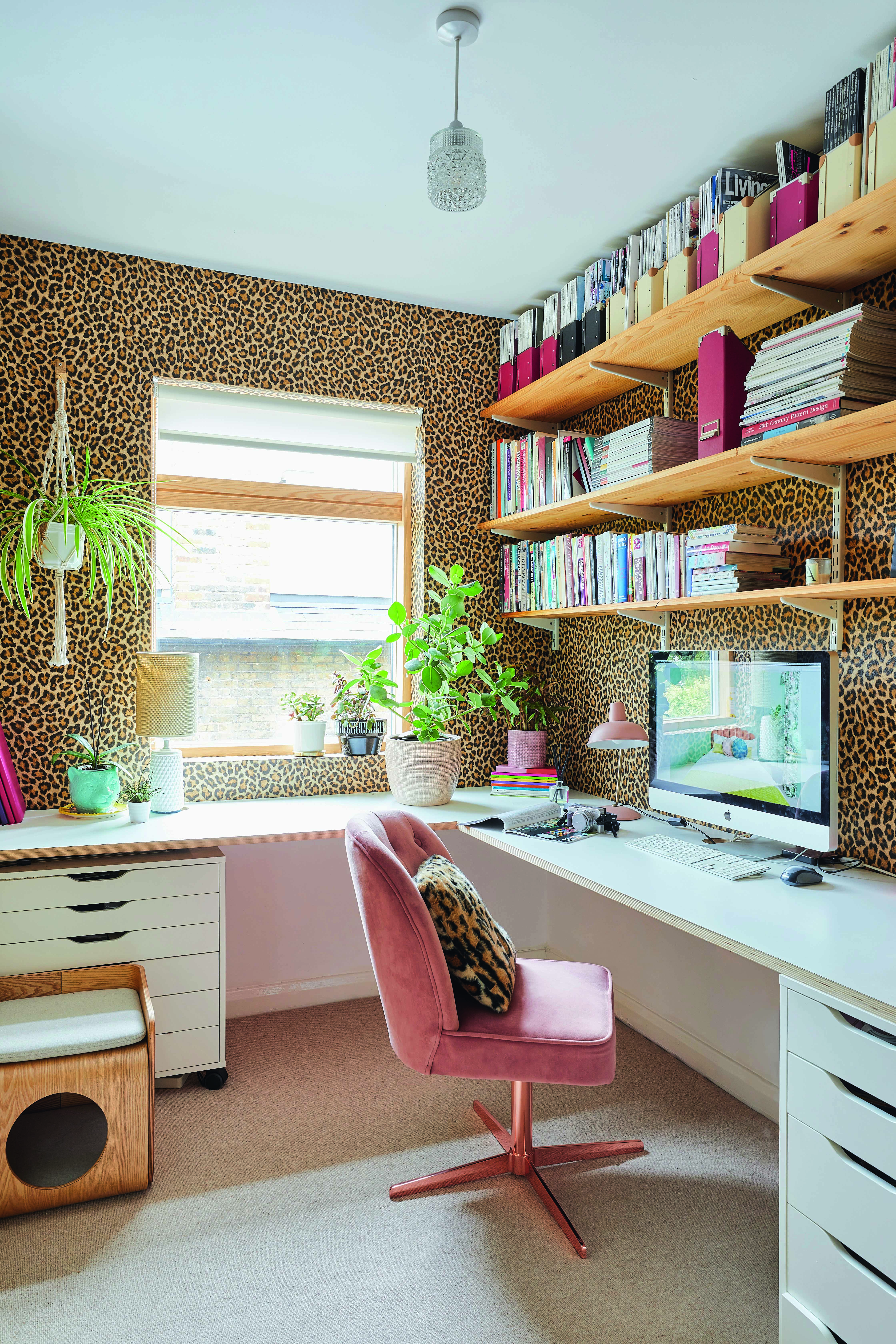Bo House2534 ‘In lockdown this room has been a godsend,’ Bo says. Leopard-print wallpaper from Albany gives the room a fun, bold look with the pink swivel chair from Cult Furniture topping off the glam style. A made-to-measure desk and shelving provides Bo with plenty of work and storage space