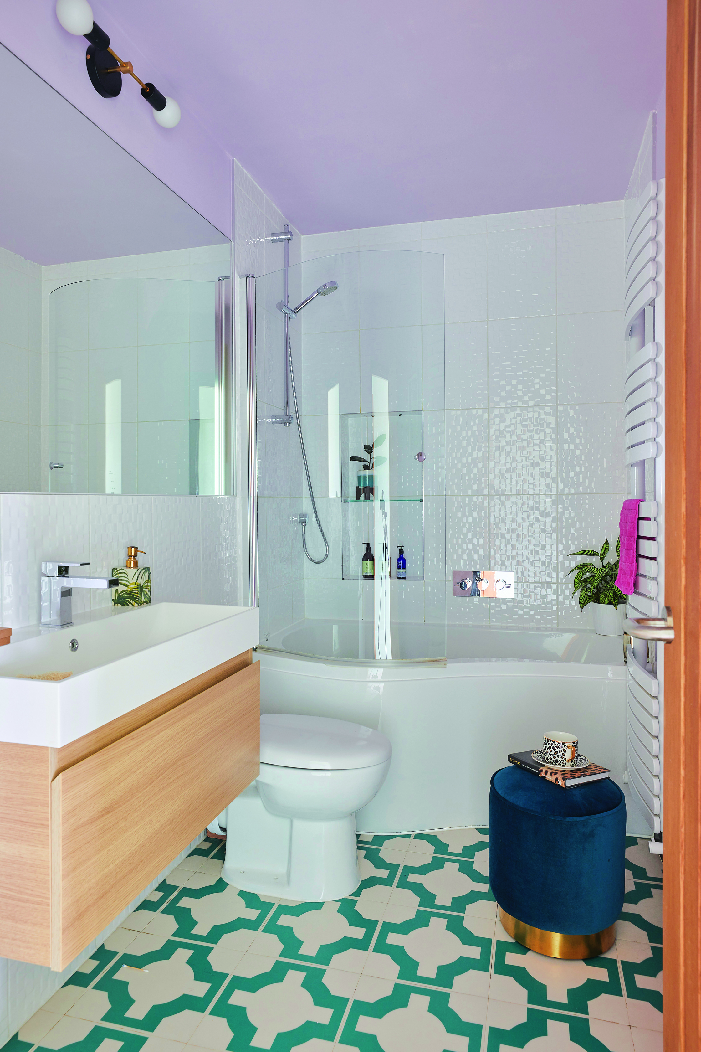Bo House2530 The pink and green theme continues into the en suite bathroom, which Bo has updated with modern retro lighting, cool tiles and a pink ceiling
