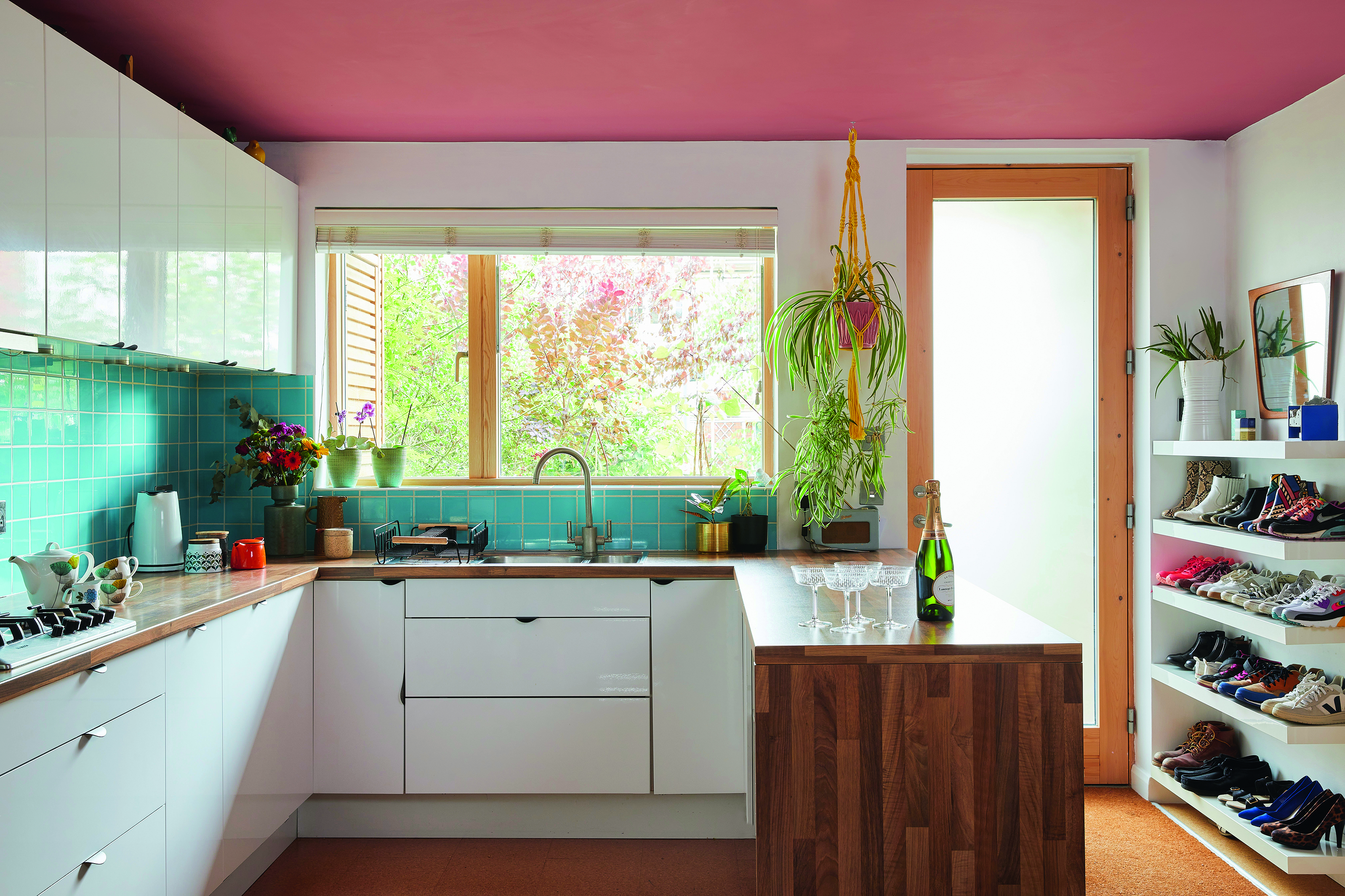 Bo House2589 ‘White gloss cabinets bounce light around and are wipe clean, which is a must with small children – same goes with the laminate worktops,’ says Bo