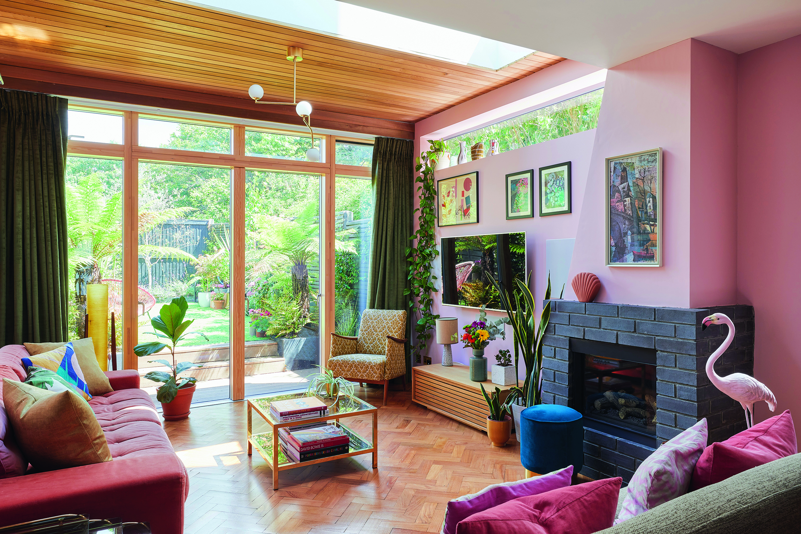 Bo House2496 ‘One of the main focal points in here is the fireplace, which I designed myself,’ says Bo. ‘I love the reclaimed parquet floor and the fact that all the electrics are fixed into the walls so there’s no trailing wires.’ The corner lamp is from eBay and the flamingo is from an antiques shop in Hampton Court