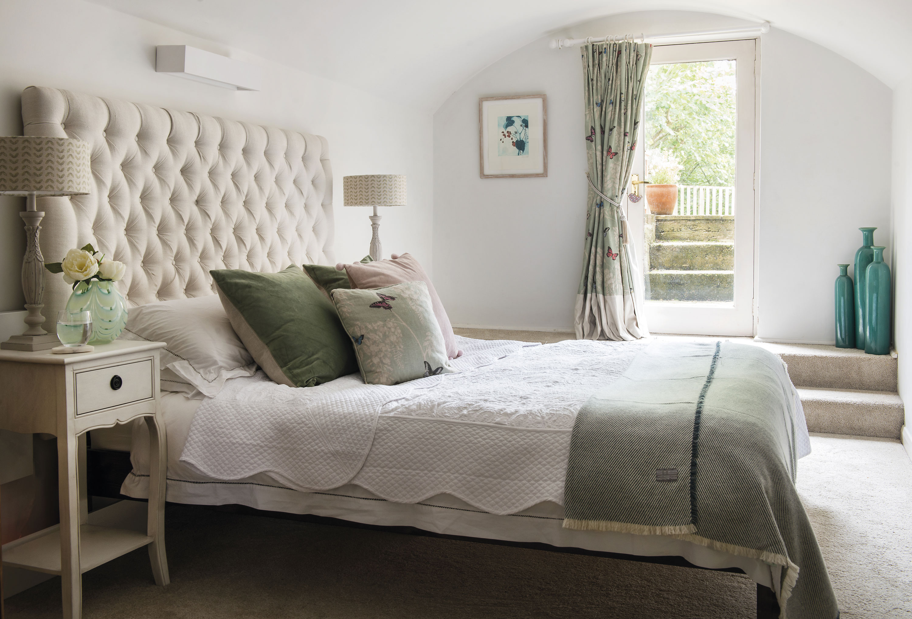 The large guest bedroom in the basement extension has been made welcoming with curtains in Wisteria and Butterfly fabric by Sanderson and lampshades by Millie & Rose Designs The large guest bedroom in the basement extension has been made welcoming with curtains in Wisteria and Butterfly fabric by Sanderson and lampshades by Millie & Rose Designs