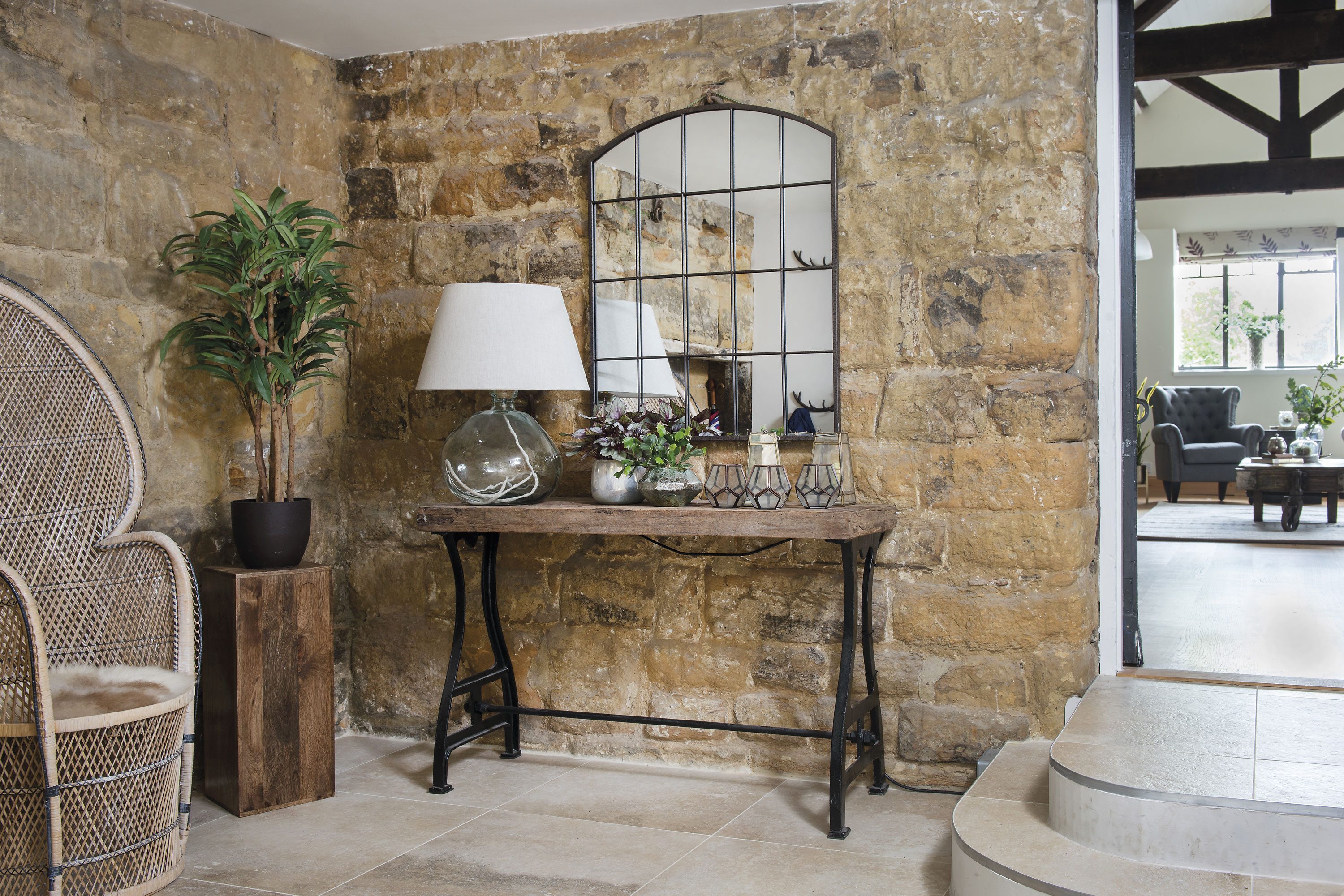 In the spacious hallway Charlie has added a vintage wicker chair from Room Seven Interiors and a brand-new mirror from Mirror Outlet to reflect the light