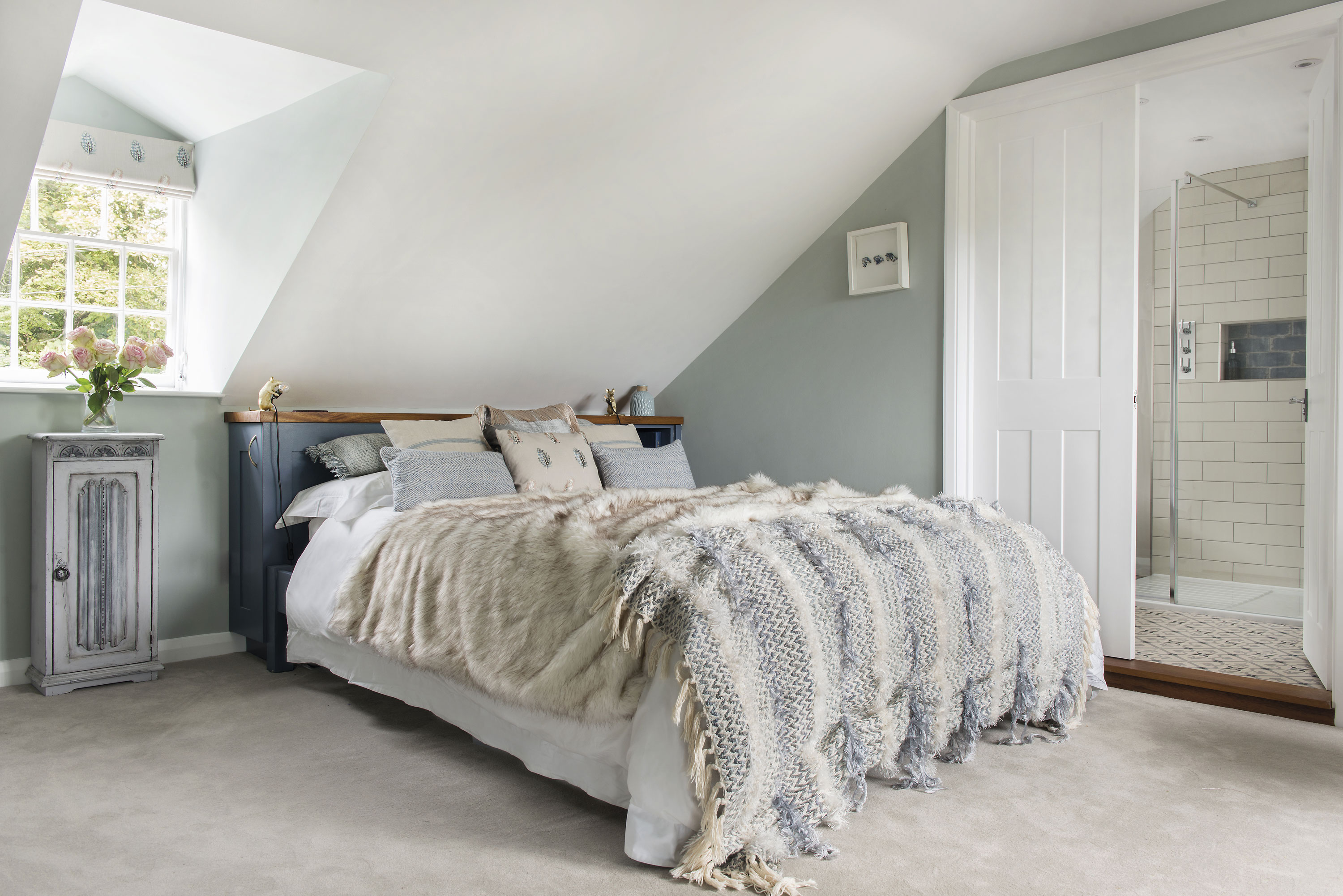 In the main bedroom in the loft, Charlie has painted the walls in a grey by Paint & Paper Library and, for a touch of fun, she’s added some gold mouse lamps to the headboard, both by Graham & Green In the main bedroom in the loft, Charlie has painted the walls in a grey by Paint & Paper Library and, for a touch of fun, she’s added some gold mouse lamps to the headboard, both by Graham & Green