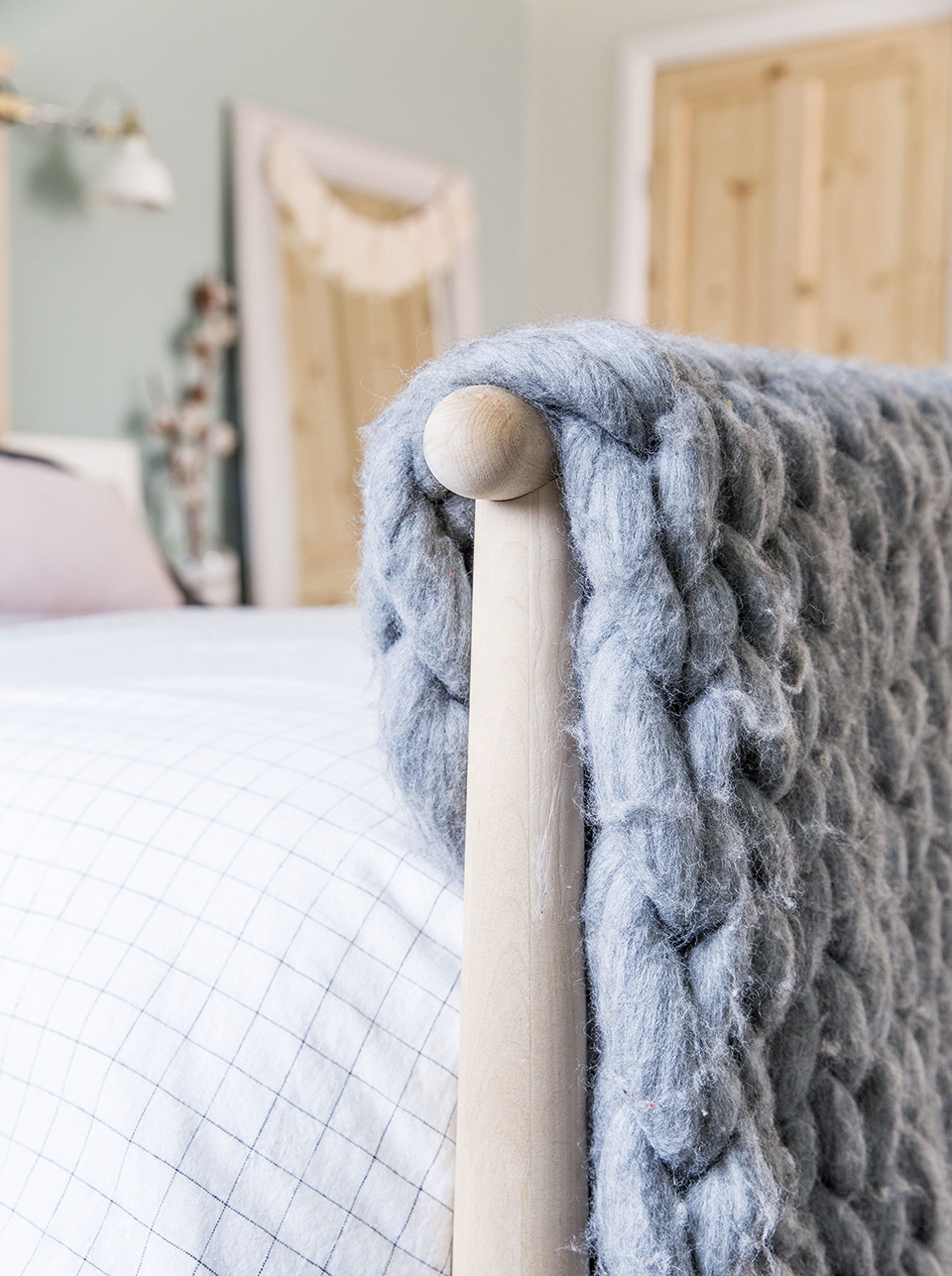My style advice - Layer your bed with blankets for a Scandi feel