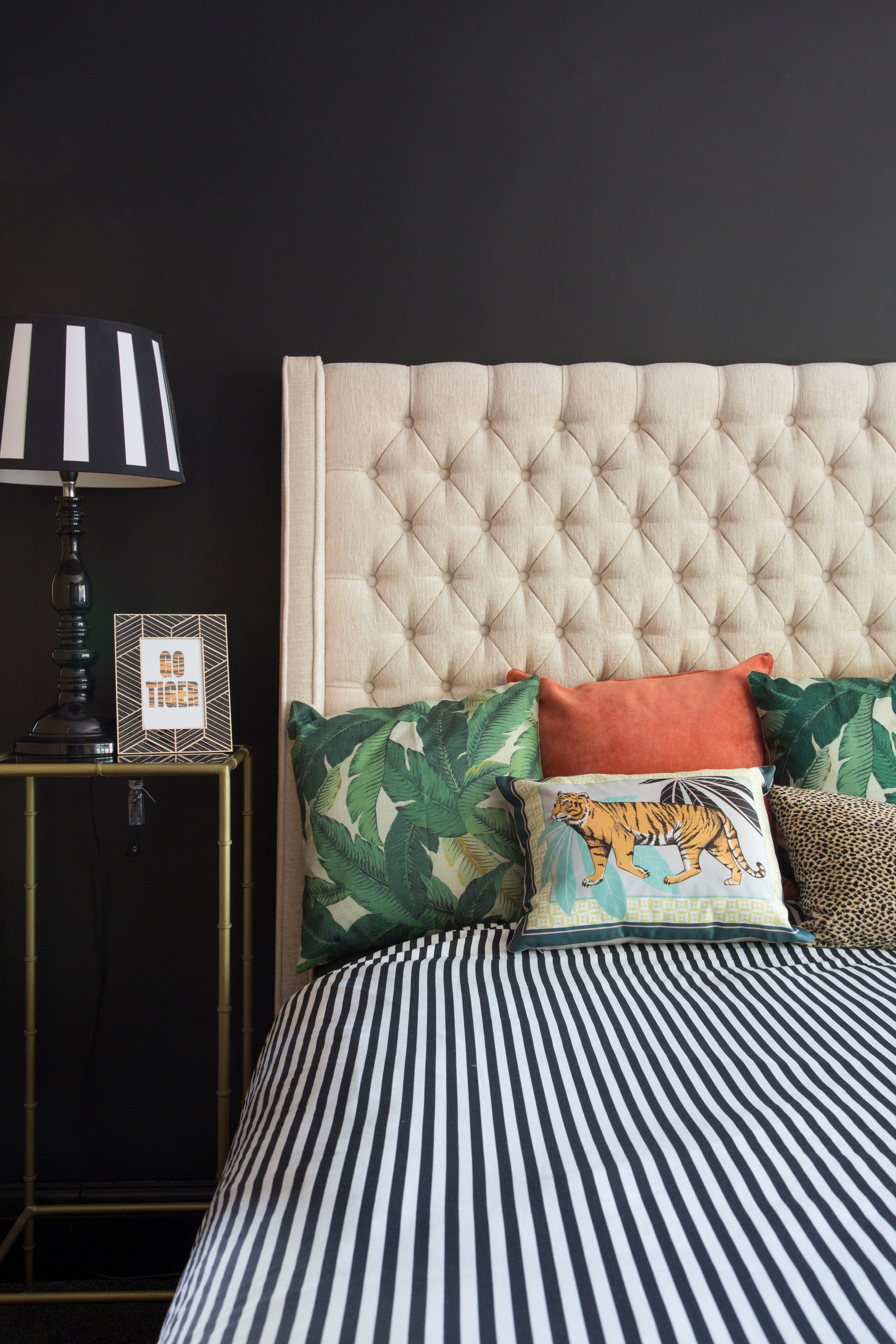 ‘Originally, the master bedroom was white and pillar box red with a cream carpet,’ Kirstie recalls. ‘It doesn’t get much sun as it’s north-facing, so instead of forcing it to be light, I leant into its natural darkness and painted the walls black. I sometimes suffer from migraines, so the black walls are perfect for keeping the room cosy and dark. It’s great for hangovers too!’ ‘Originally, the master bedroom was white and pillar box red with a cream carpet,’ Kirstie recalls. ‘It doesn’t get much sun as it’s north-facing, so instead of forcing it to be light, I leant into its natural darkness and painted the walls black. I sometimes suffer from migraines, so the black walls are perfect for keeping the room cosy and dark. It’s great for hangovers too!’