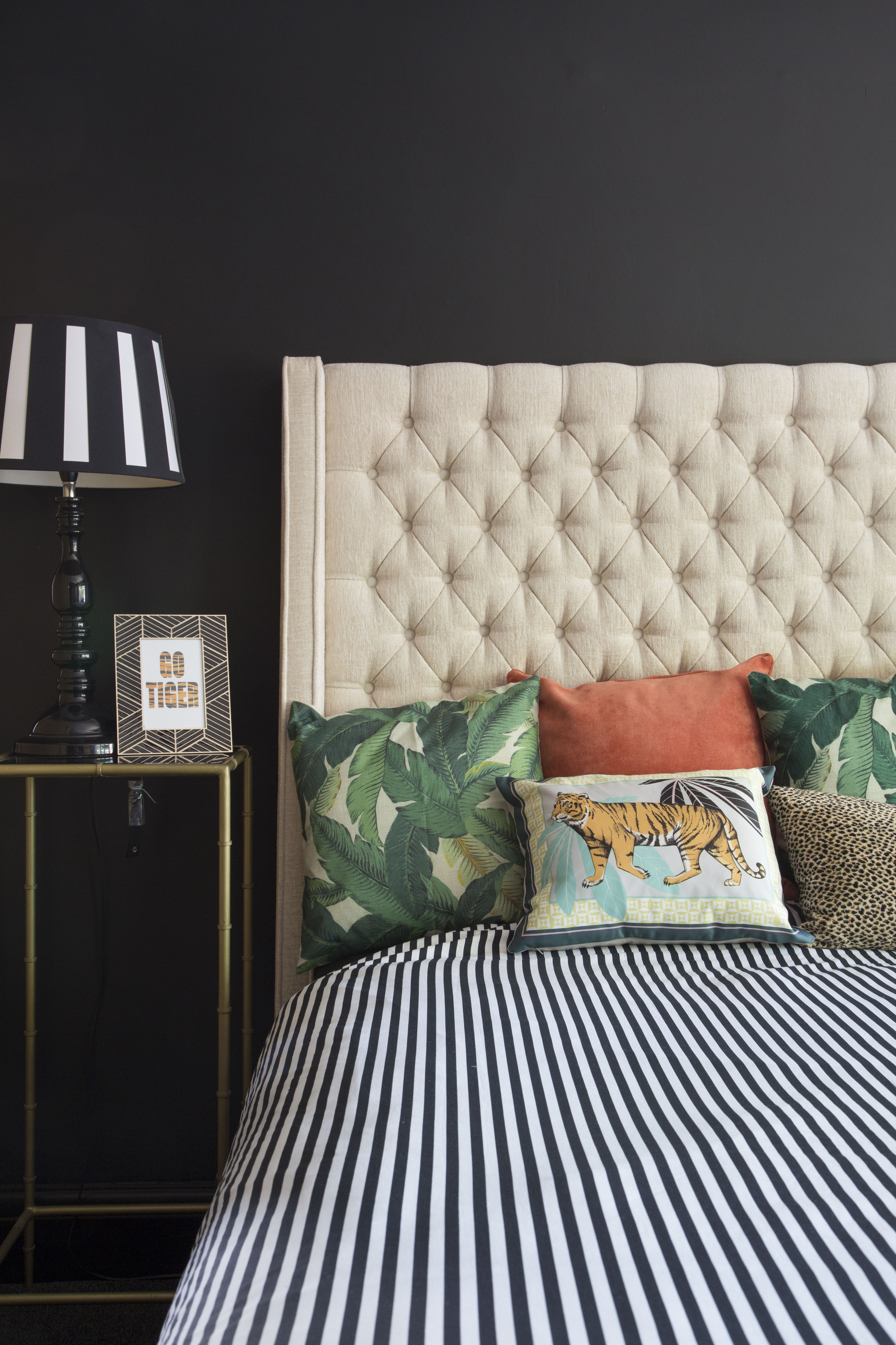 ‘Originally, the master bedroom was white and pillar box red with a cream carpet,’ Kirstie recalls. ‘It doesn’t get much sun as it’s north-facing, so instead of forcing it to be light, I leant into its natural darkness and painted the walls black. I sometimes suffer from migraines, so the black walls are perfect for keeping the room cosy and dark. It’s great for hangovers too!’ ‘Originally, the master bedroom was white and pillar box red with a cream carpet,’ Kirstie recalls. ‘It doesn’t get much sun as it’s north-facing, so instead of forcing it to be light, I leant into its natural darkness and painted the walls black. I sometimes suffer from migraines, so the black walls are perfect for keeping the room cosy and dark. It’s great for hangovers too!’