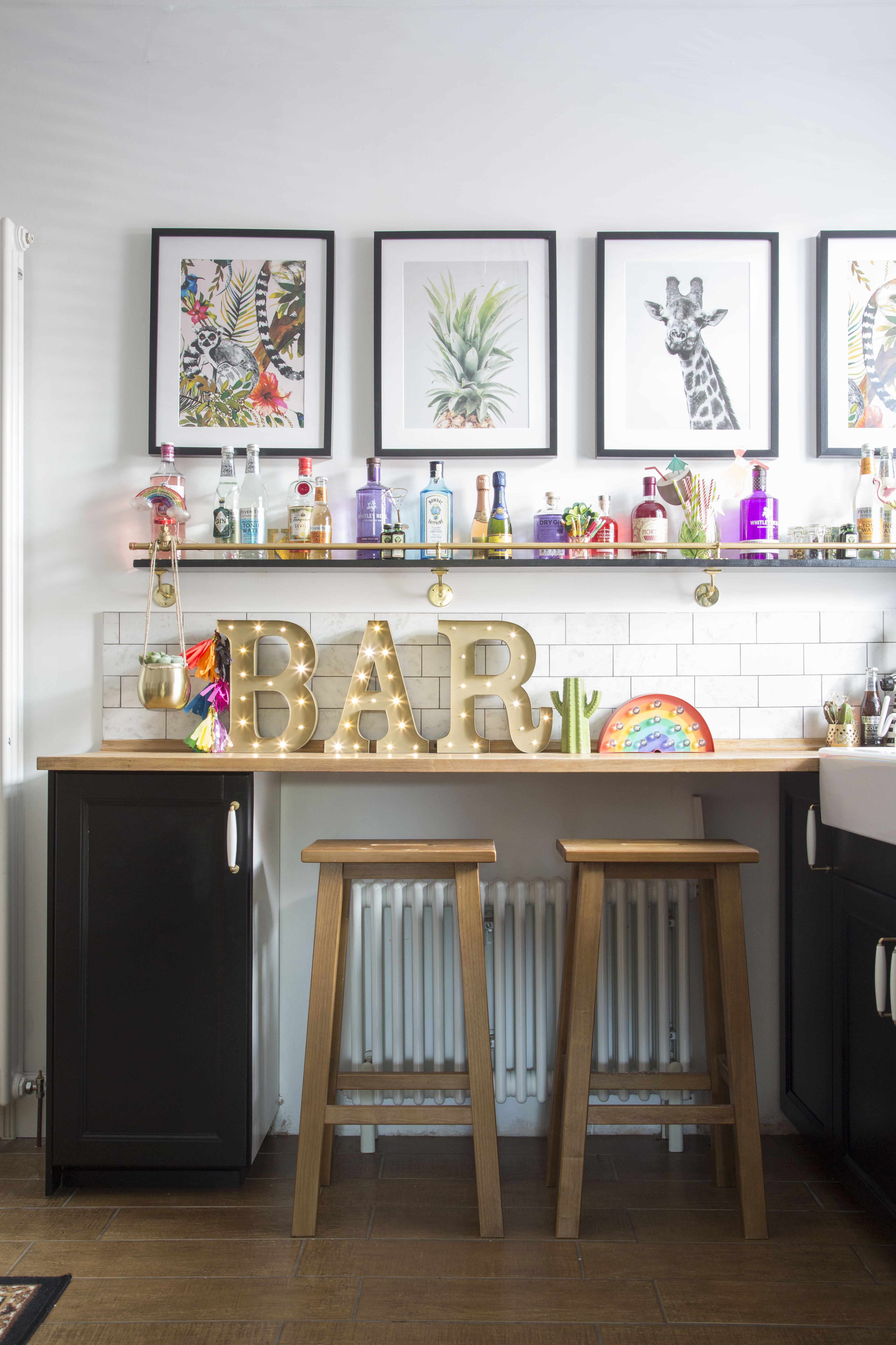 ‘My favourite make in the kitchen has to be my gin shelves,’ says Kirstie. ‘They were easy to build using basic timber and plumbing fittings, and they really lift the space with all of the colourful bottles on display’ ‘My favourite make in the kitchen has to be my gin shelves,’ says Kirstie. ‘They were easy to build using basic timber and plumbing fittings, and they really lift the space with all of the colourful bottles on display’