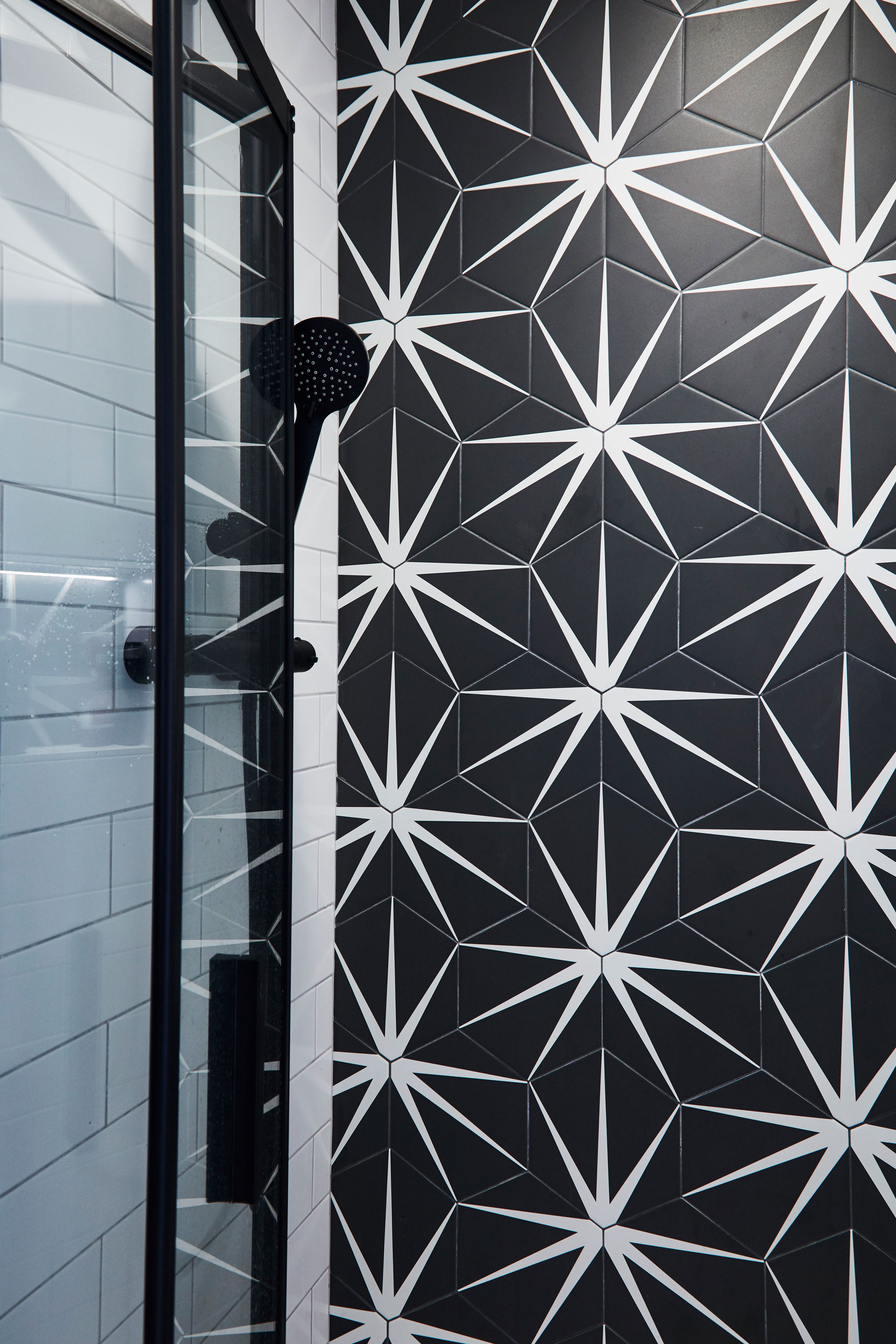 Bathroom makeover: 'I surprised my family with a sleek new bathroom' Good idea! Tile a feature wall, as Emily has, for a low-cost way to use more expensive tiles in your scheme