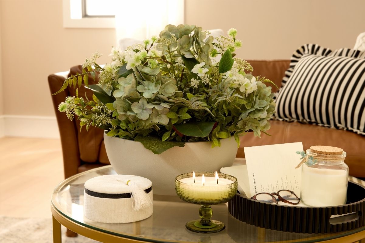 Plant and candle on table